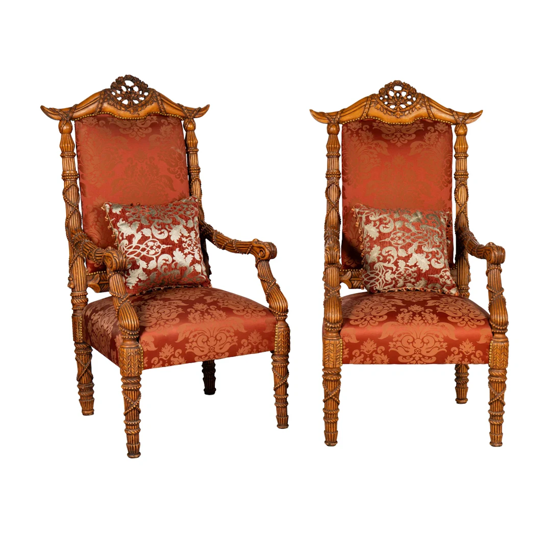 A Pair of Wood Carved and Upholstered Arm Chairs