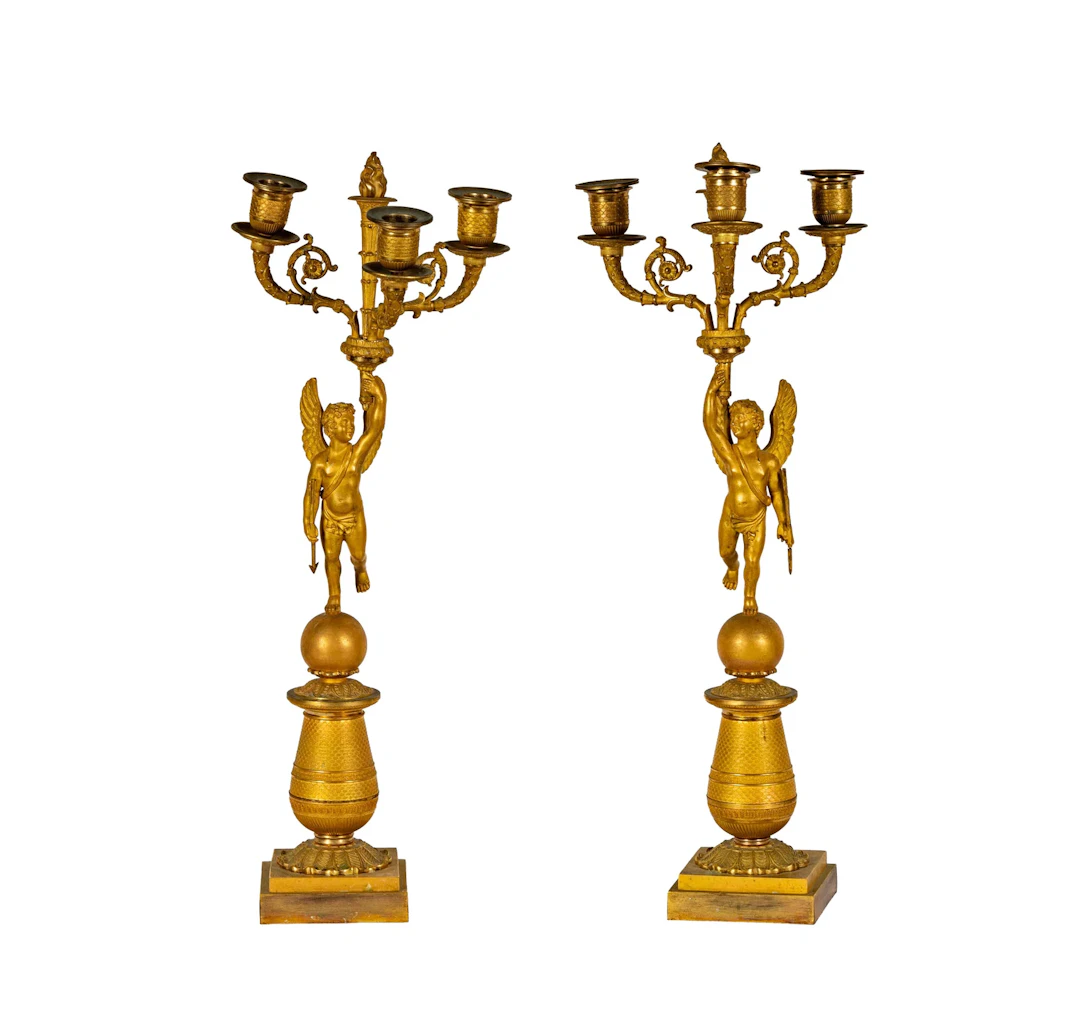 A Pair of French Empire Ormolu Cherub Form Candelabras