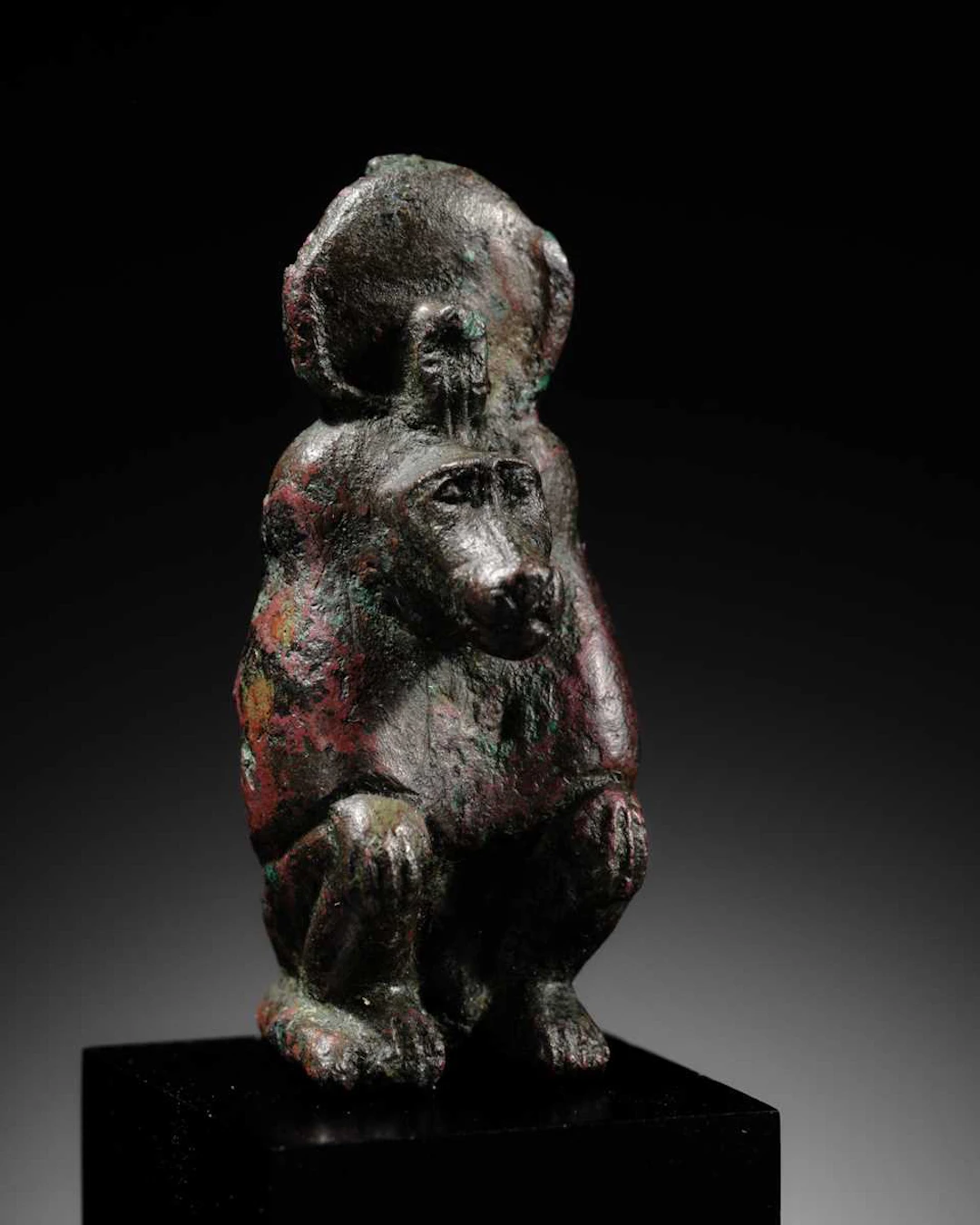 A RARE BRONZE FIGURE OF A BABOON, LATE DYNASTIC PERIOD, DYNASTY XXVI
