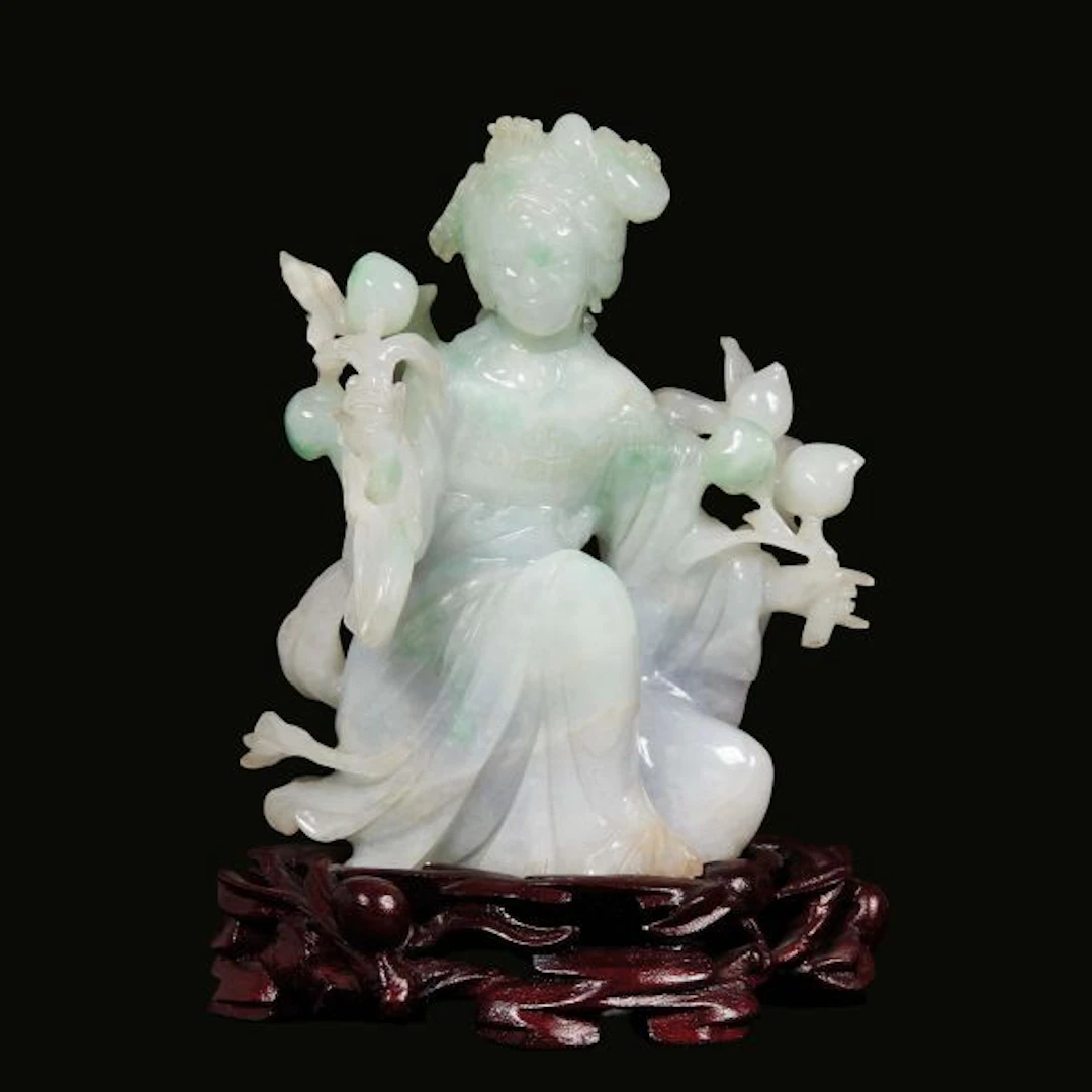 A JADEITE CARVING OF A FEMALE FIGURE, CHINA, LATE QING DYNASTY, 19TH/20TH