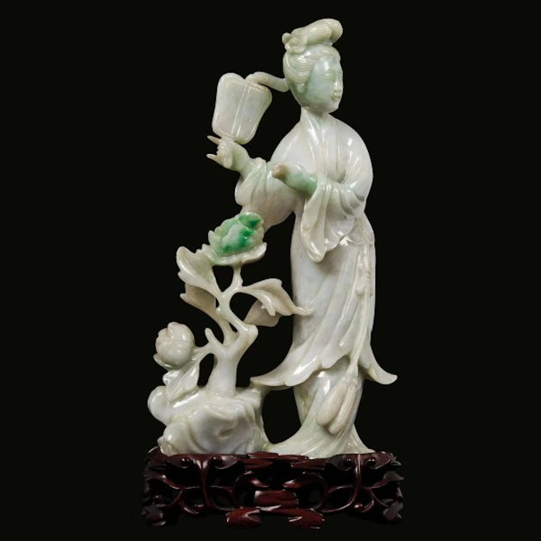 A JADEITE CARVING OF A FEMALE FIGURE, CHINA, LATE QING DYNASTY, 19TH/20TH