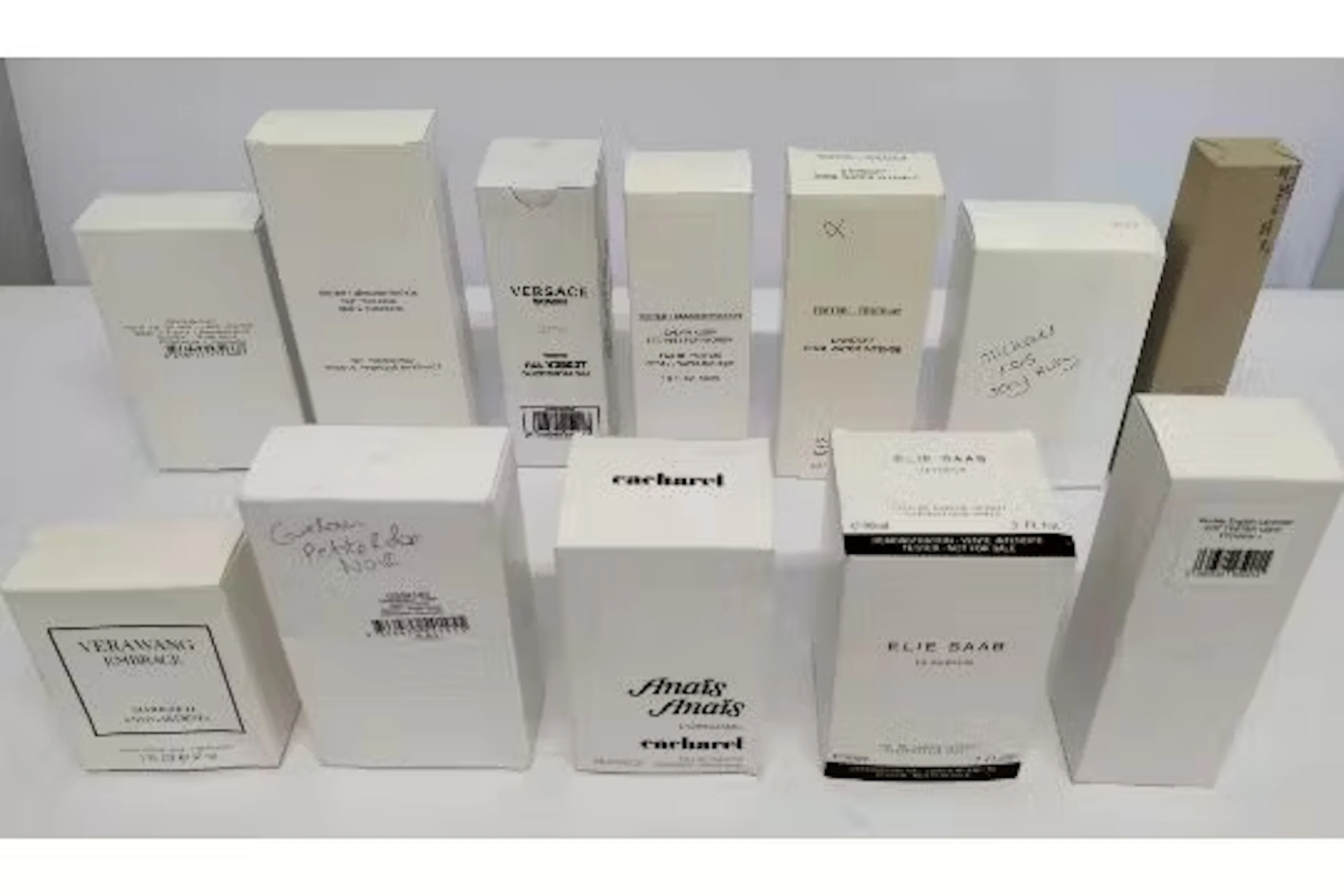 Twenty four nearly new perfumes/testers and related to include Versace