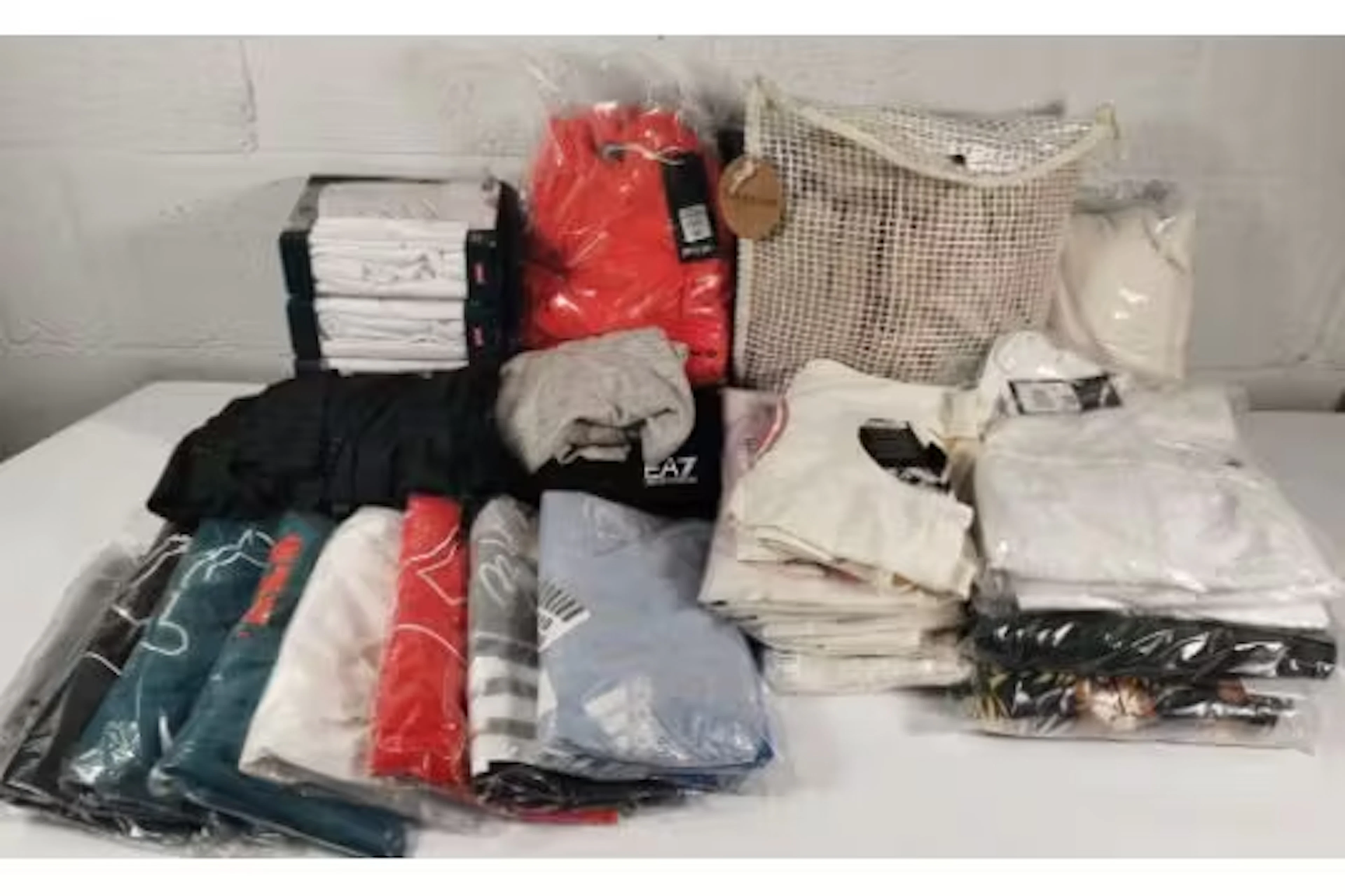 A quantity of assorted as new clothing to include Adidas, Wilson