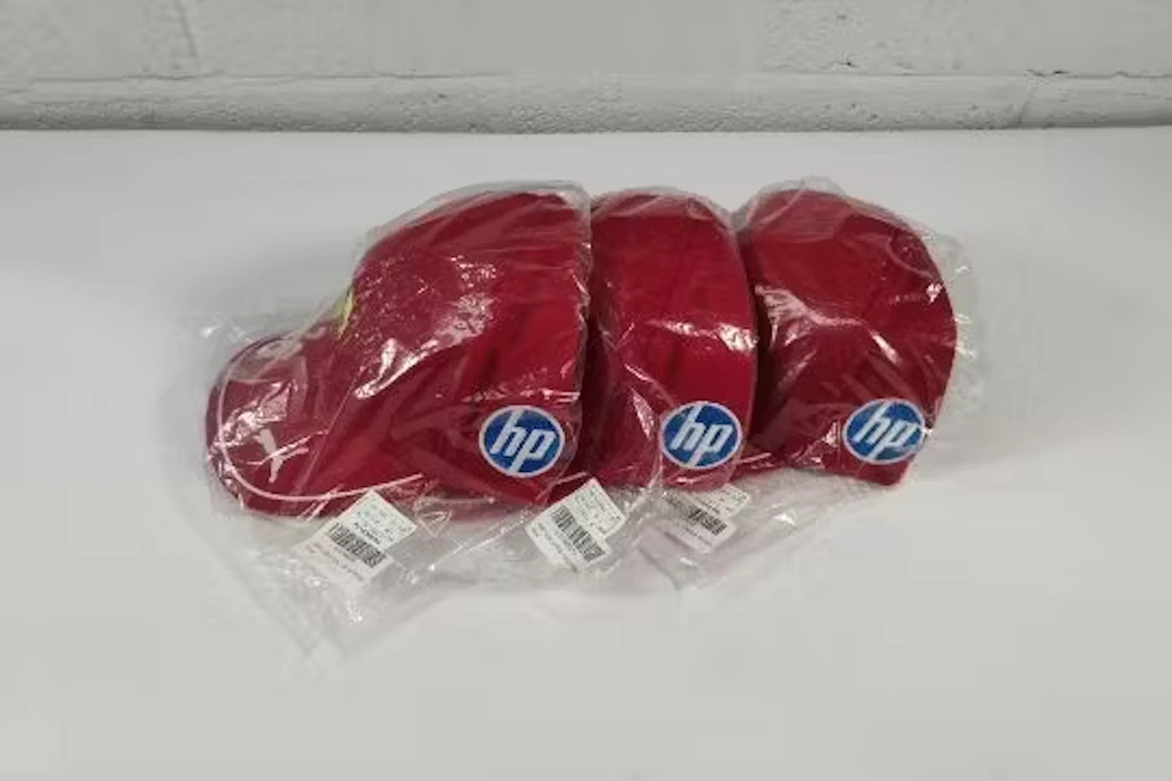 Three as new Puma Scuderia Ferrari HP Leclerc Baseball Caps, mostly