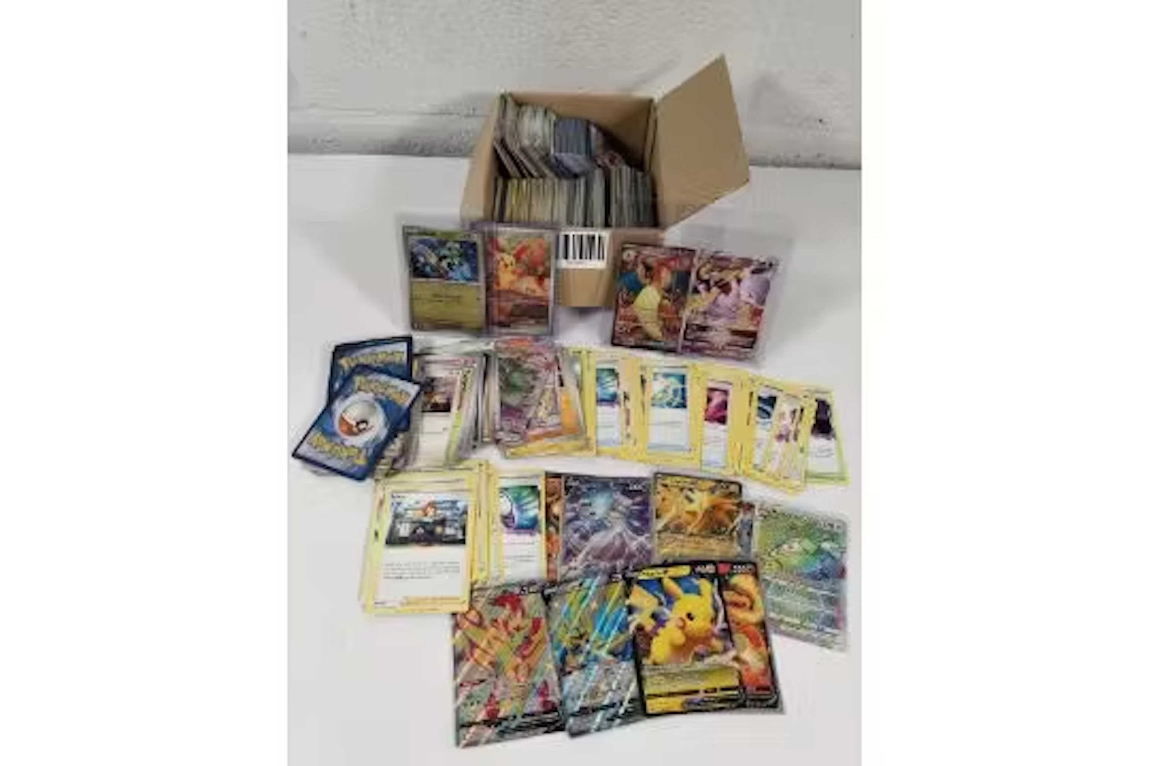 An assortment of Pokemon trading card game cards to include English