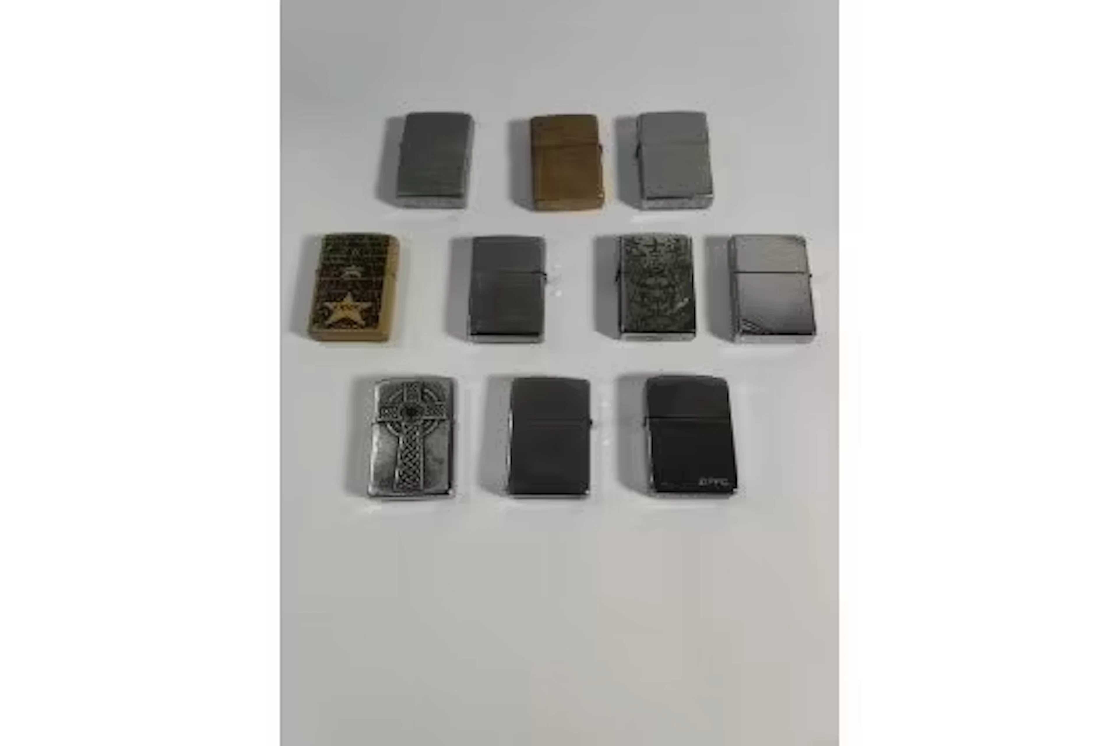 Ten assorted pre-owned Zippo windproof lighters (over 18s only).