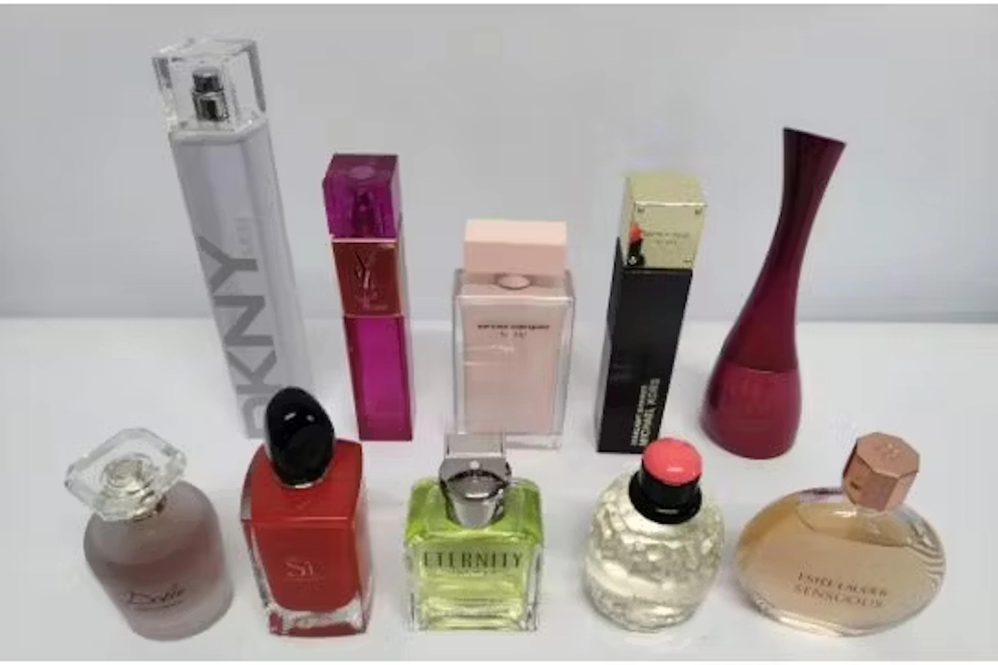 Thirty nearly new perfumes/testers and related to include YSL, Calvin