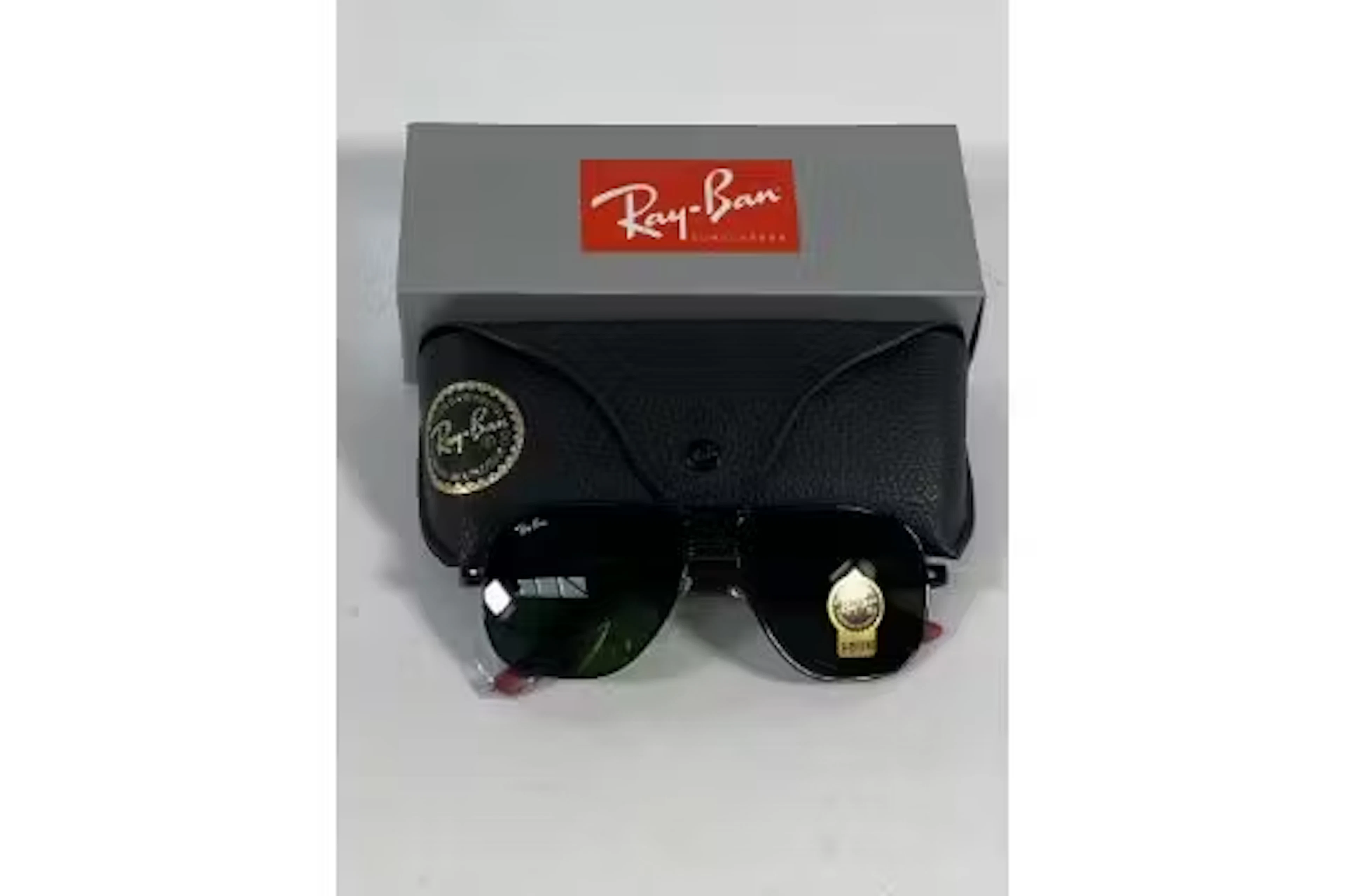 A pair of Ray-Bans Square sunglasses in black and red with G-15 green