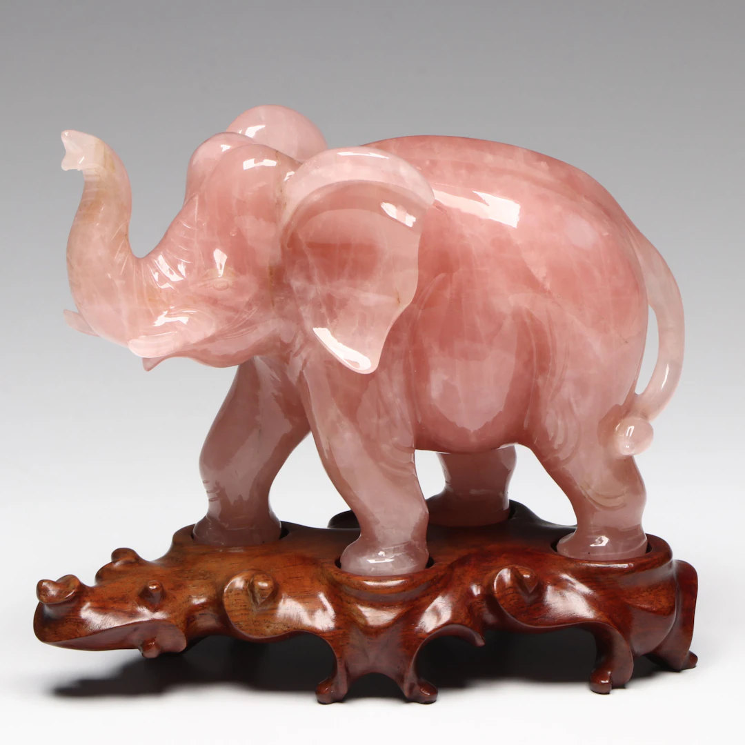 Polished Rose Quartz Elephant on Wooden Stand