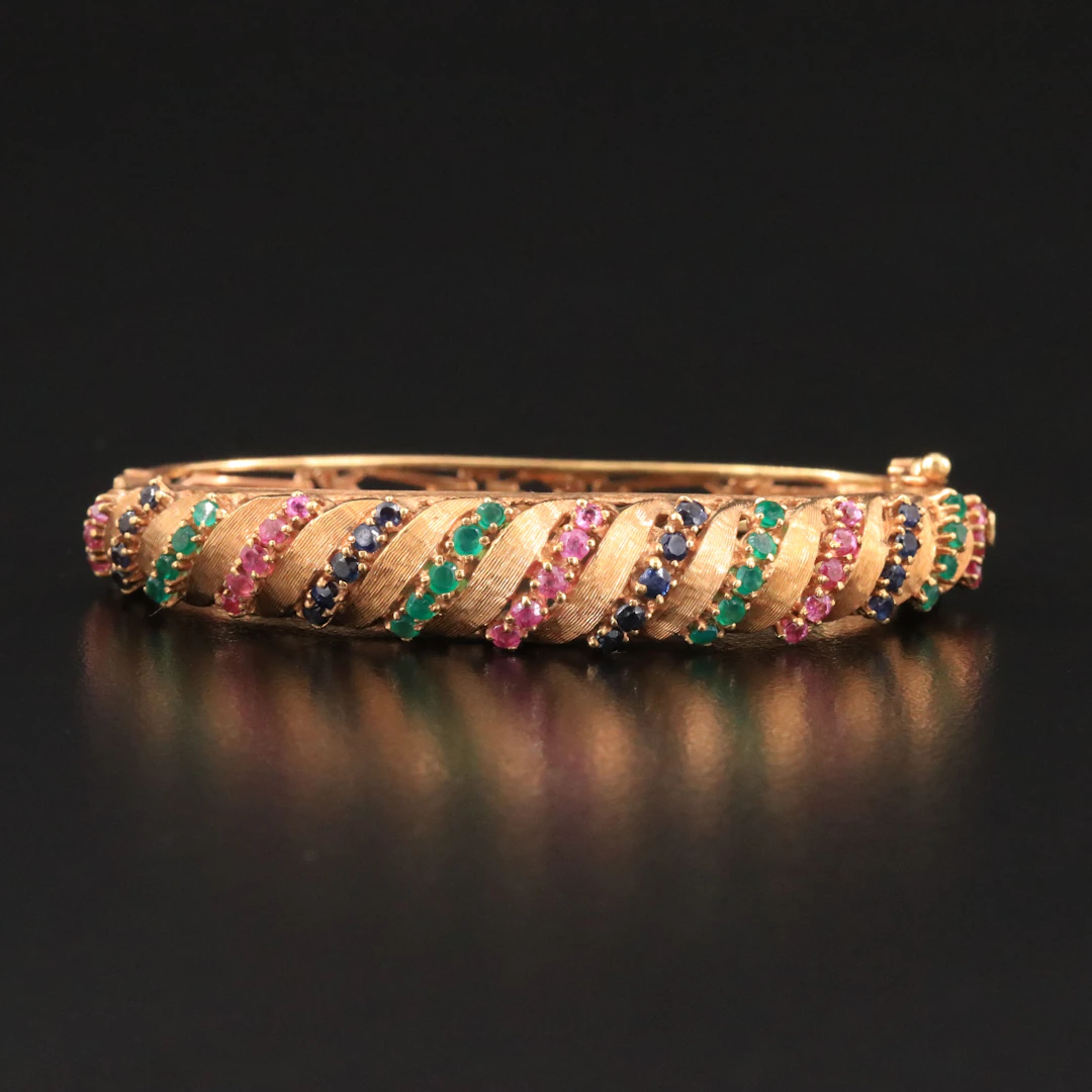 Jack Gutschneider 1960s 18K Ruby, Sapphire, and Emerald Hinged Bracelet