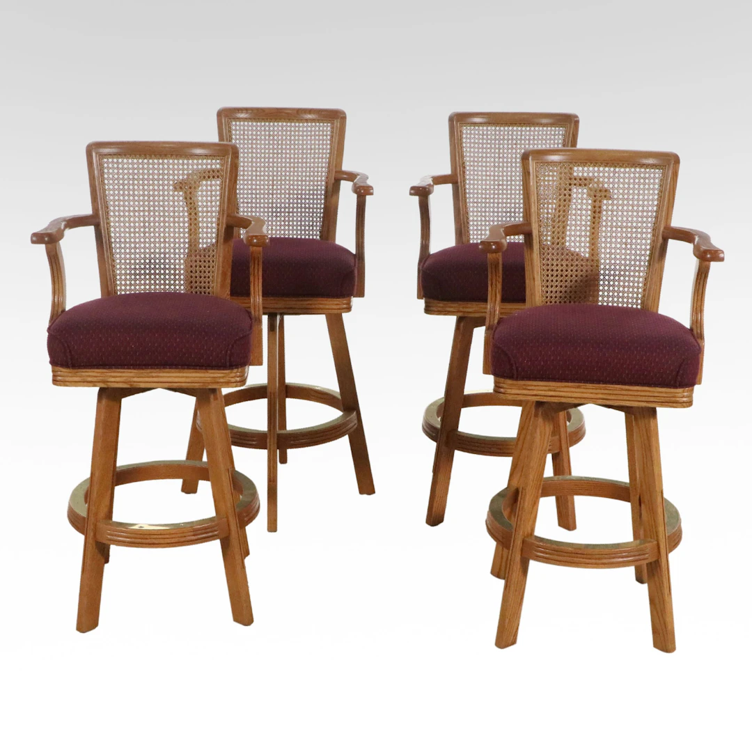 Set of Four Oak and Cane Upholstered Swivel Barstools, Late 20th Century