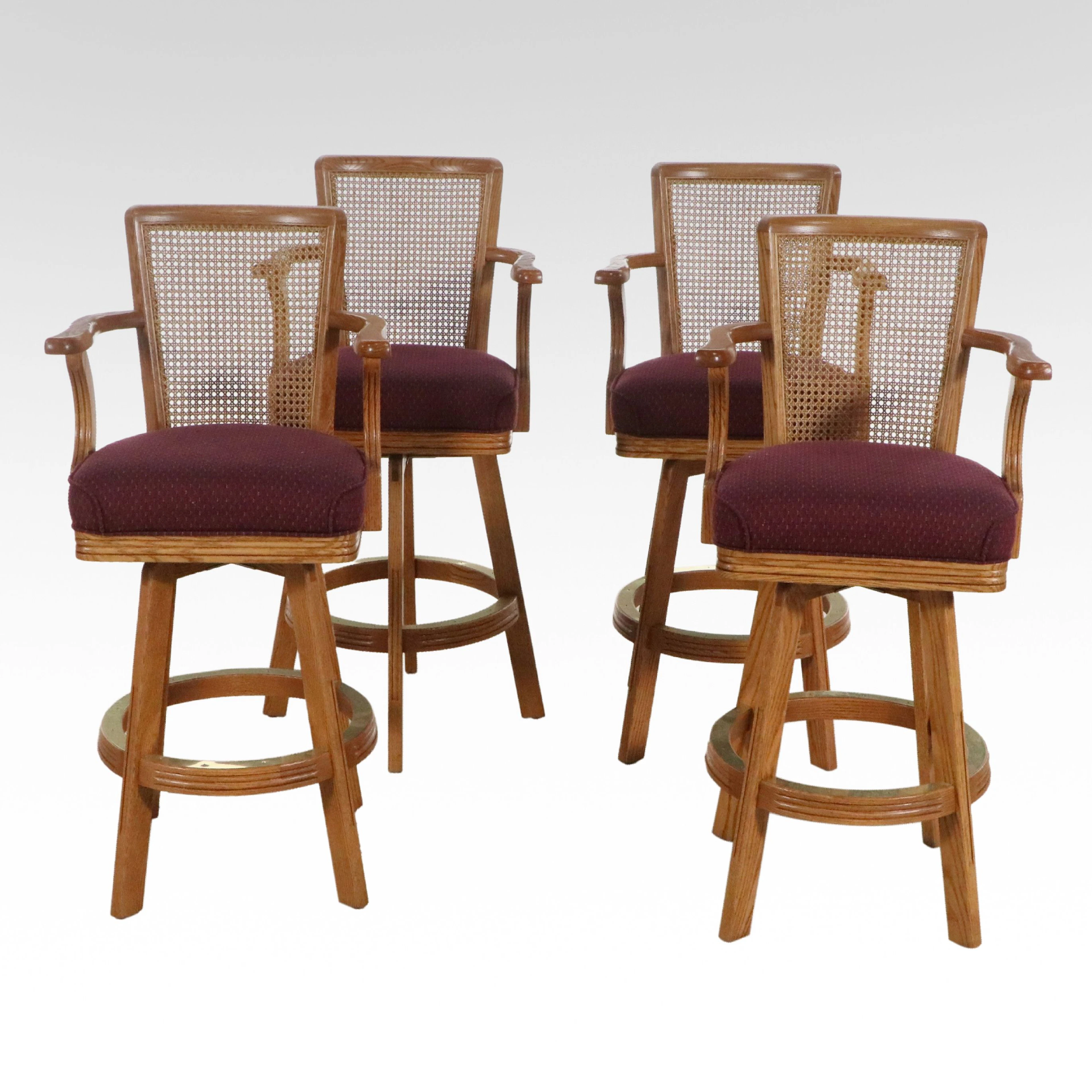 Set of Four Oak and Cane Upholstered Swivel Barstools, Late 20th Century