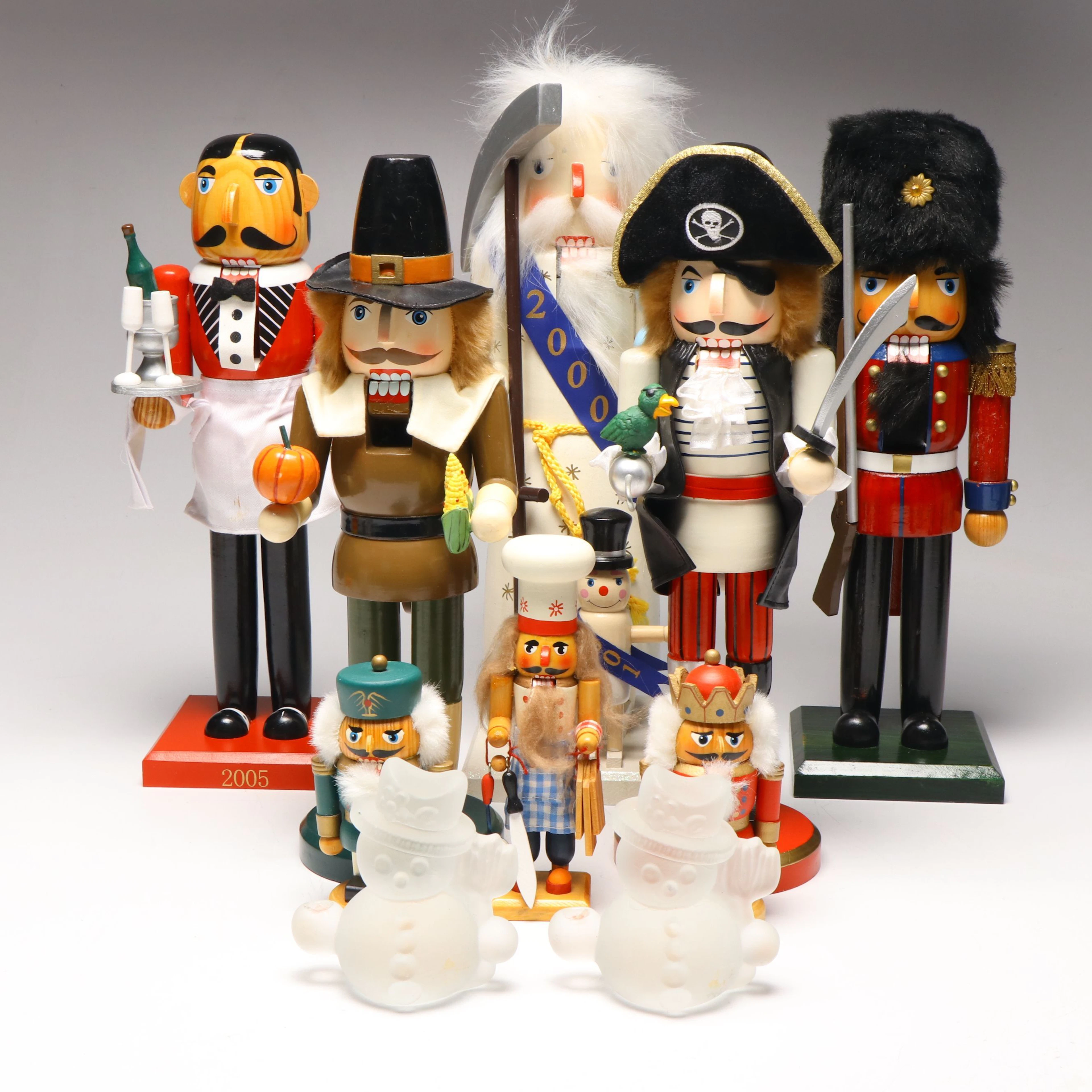 Glass Snowman Candle Holders with Pilgrim, Pirate and More Thematic Nutcrackers