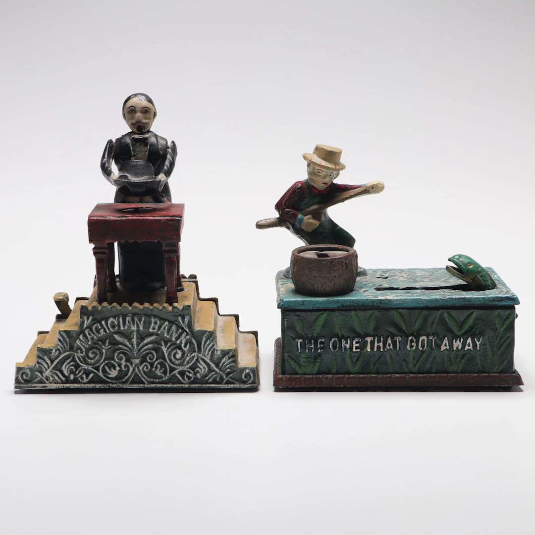 "The One That Got Away" and "Magician" Reproduction Cast Iron Banks