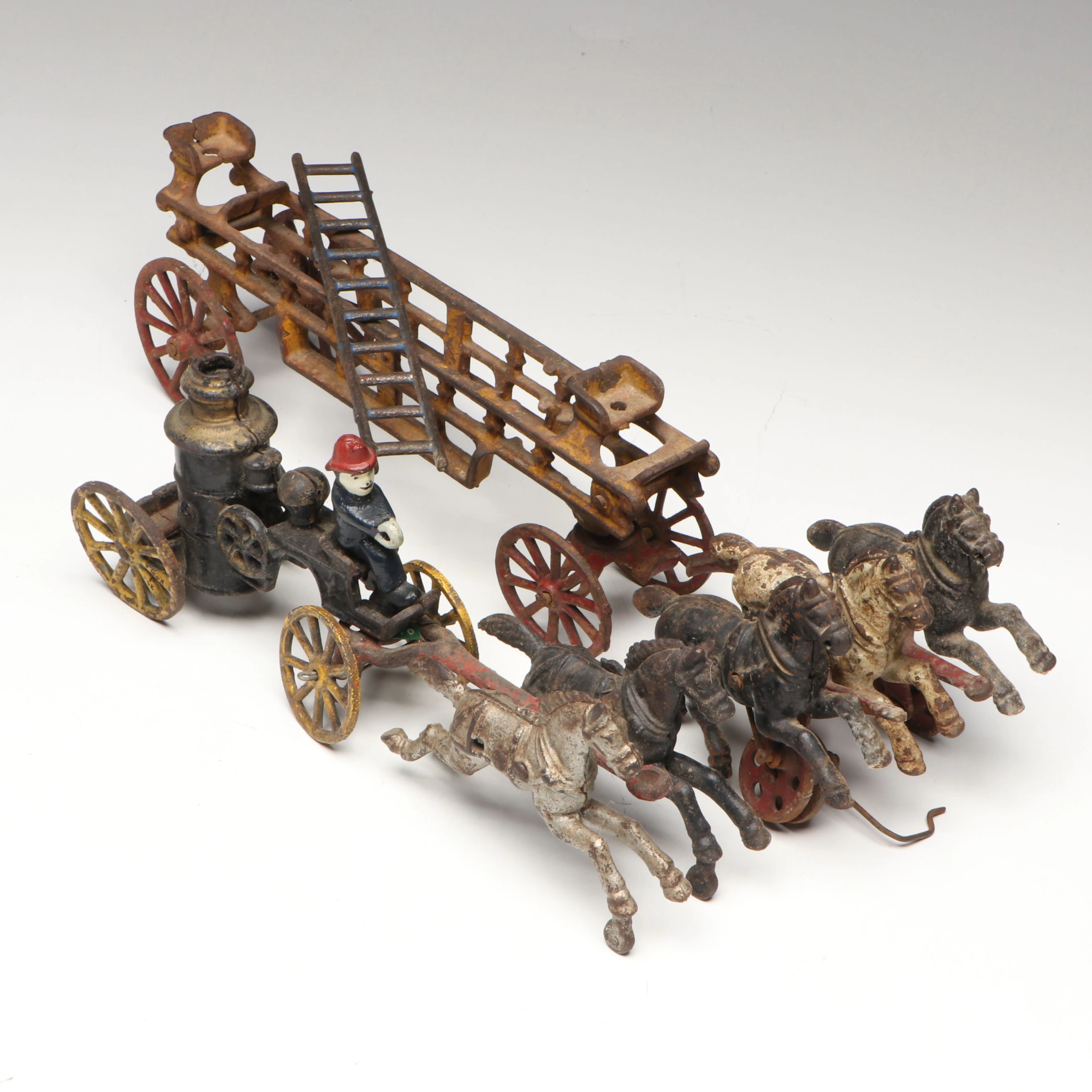 Hubley Cast Iron Horse-Drawn Fire Ladder and Water Wagon Toys