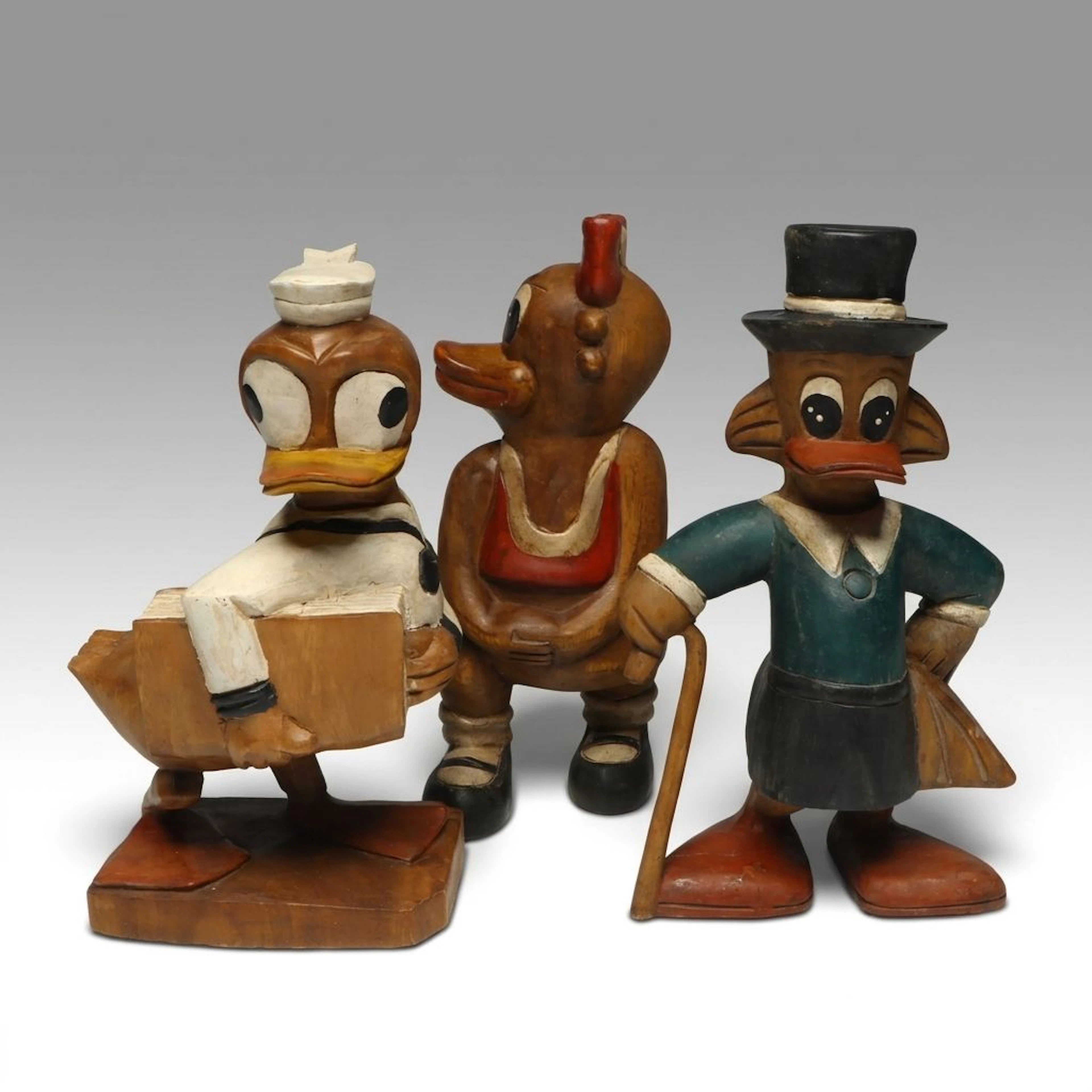 Hand-Carved Wooden Disney Style Duck Figurines, Late 20th C.