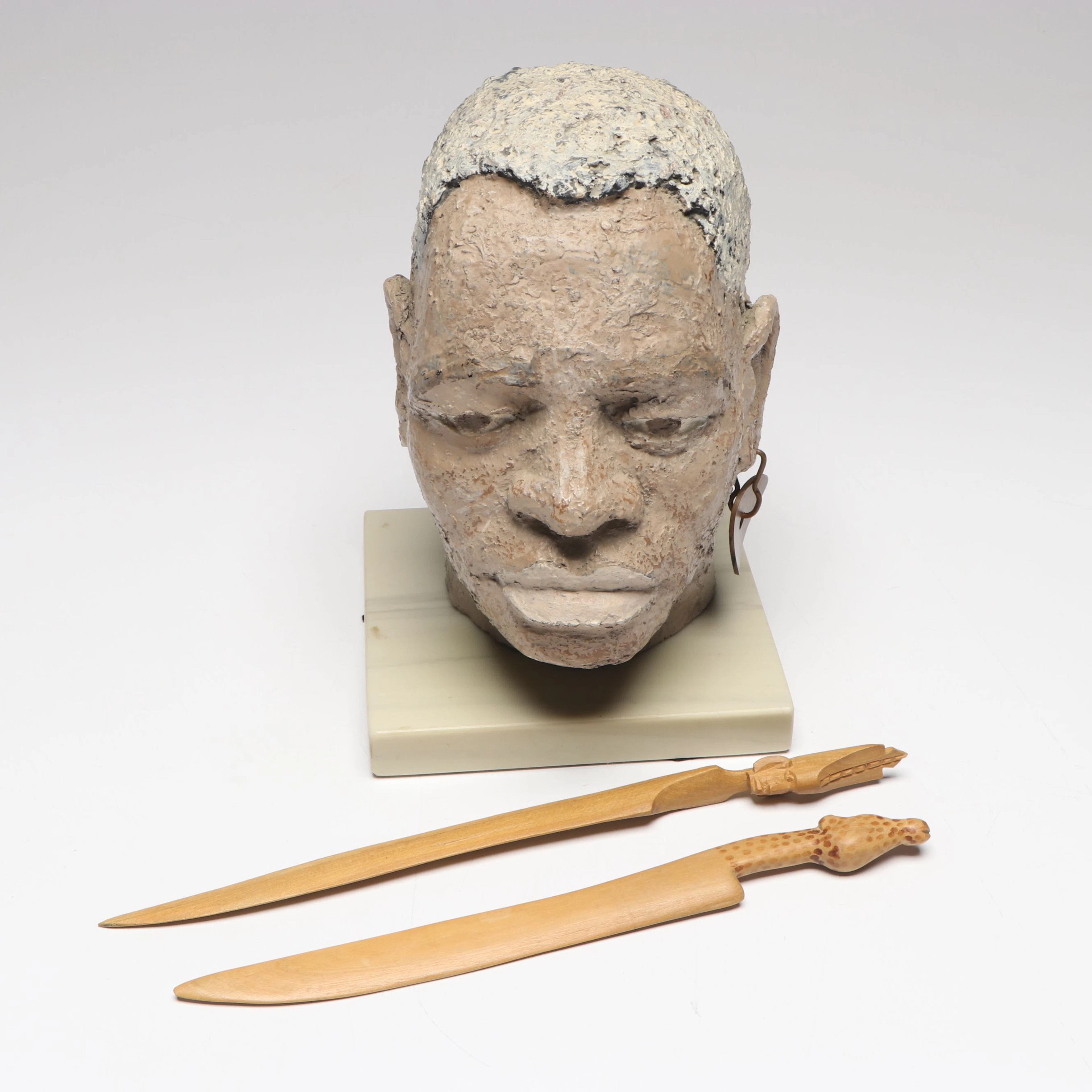 African Ceramic Bust with Wooden Knives