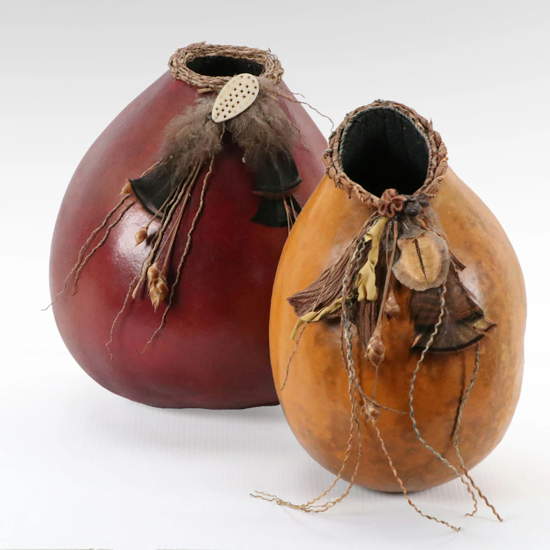 Southwestern Indigenous Gourd Vessels with Feathers and Woven Fibers