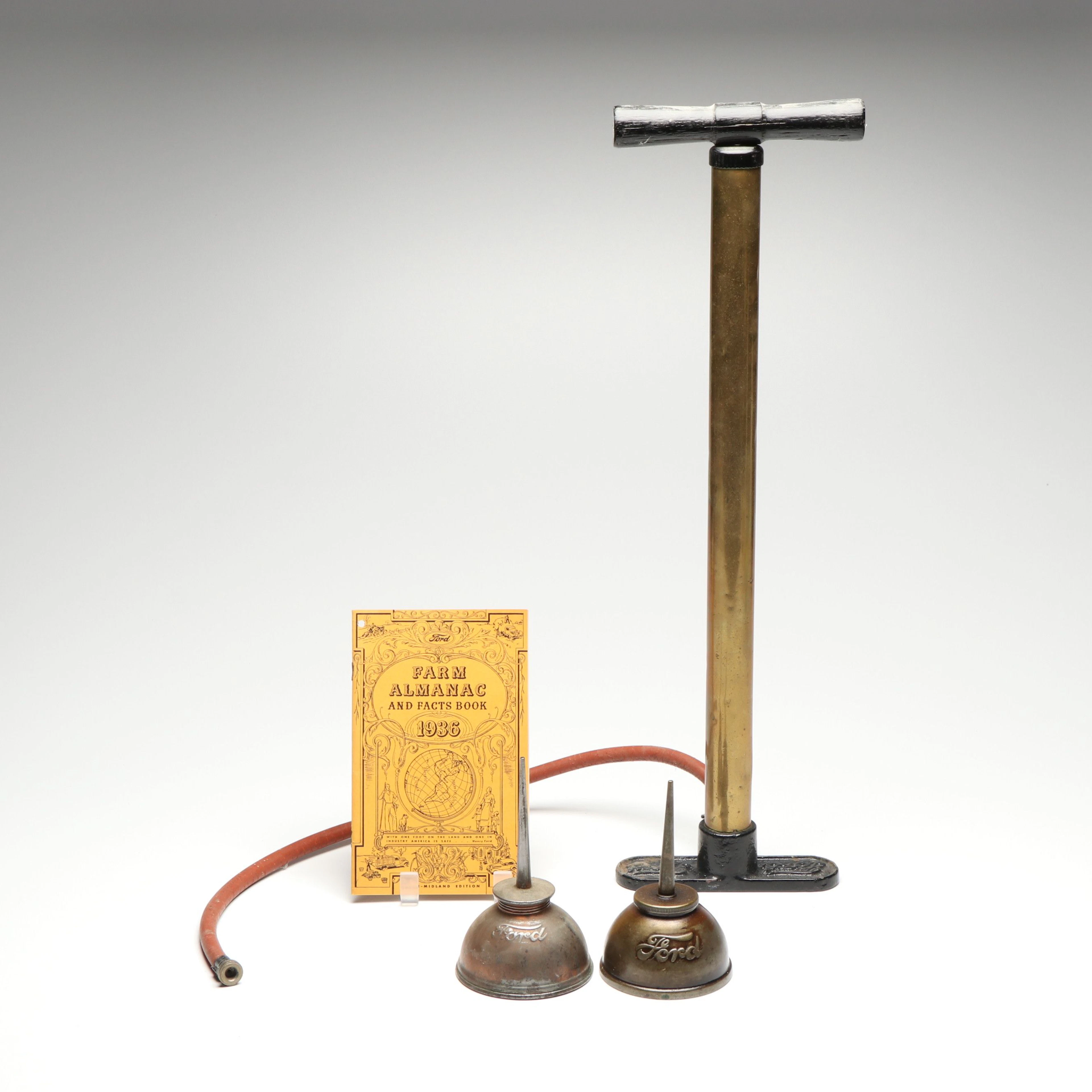 Ford Brass Tire Hand Pump and Oil Cans, Early 20th Century
