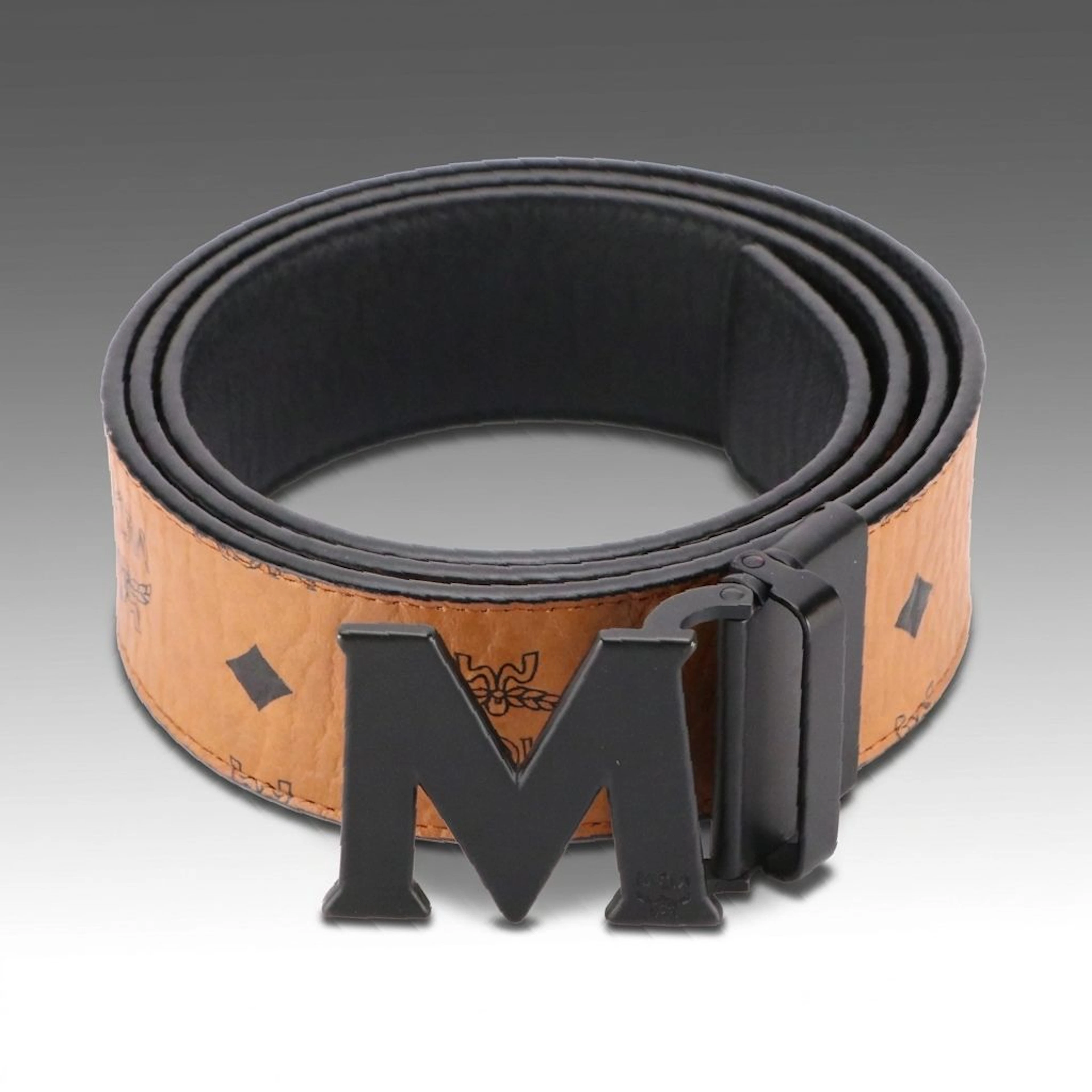 MCM Claus M Reversible Belt in Cognac Visetos Canvas and Black Nappa Leather
