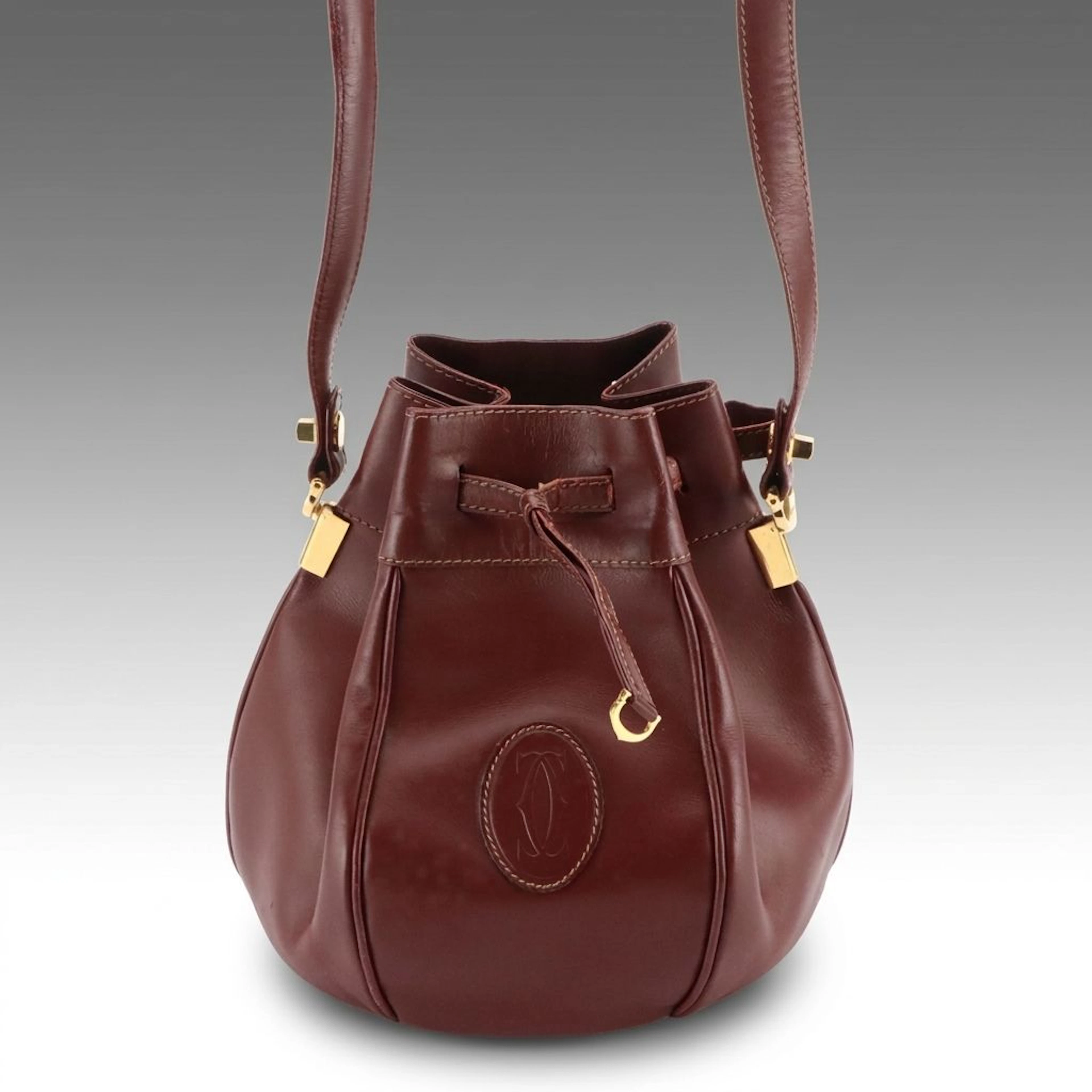 Cartier Must de Cartier Drawstring Bucket Bag in Burgundy Calfskin Leather