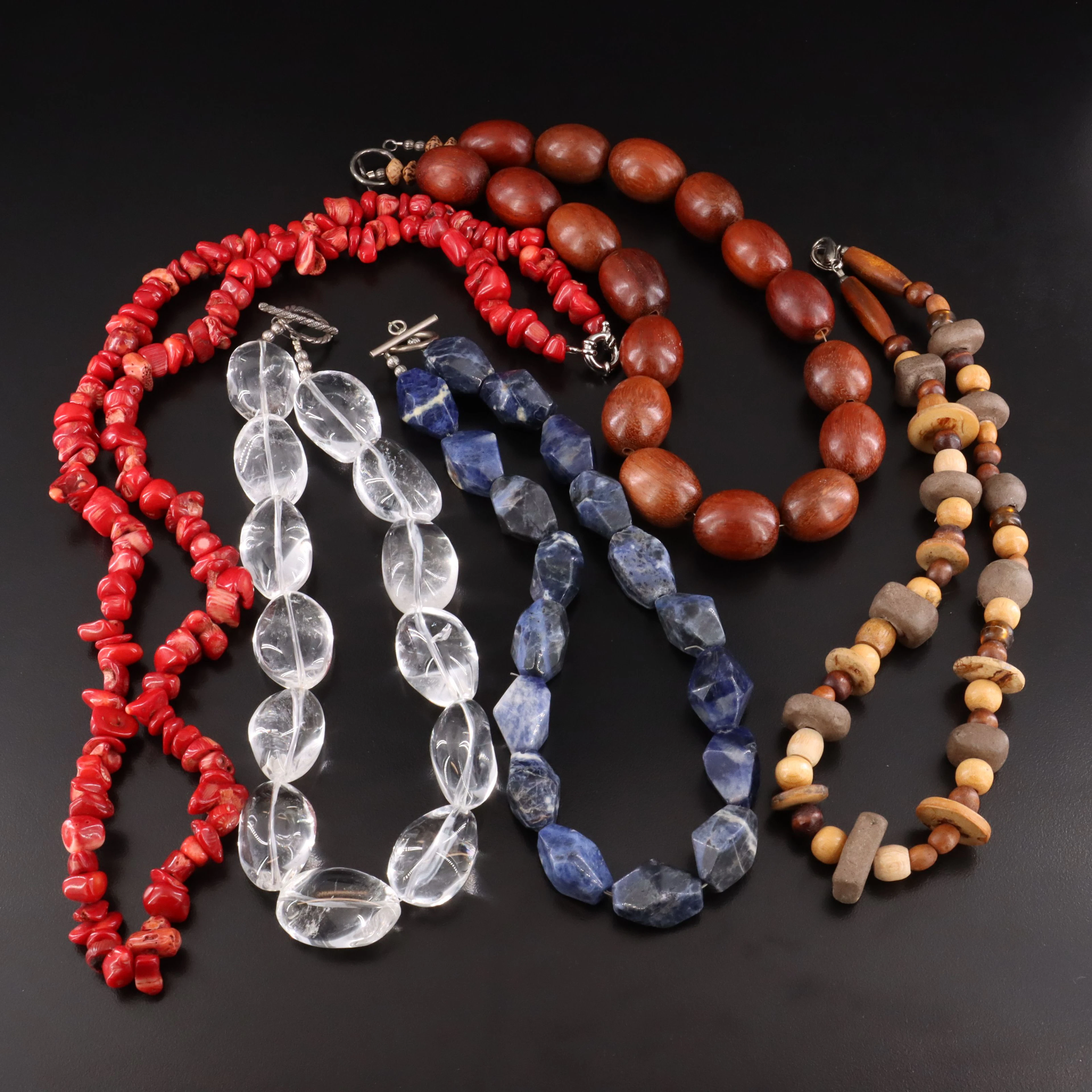 Rock Crystal, Coral and Sodalite Featured in Necklace Collection
