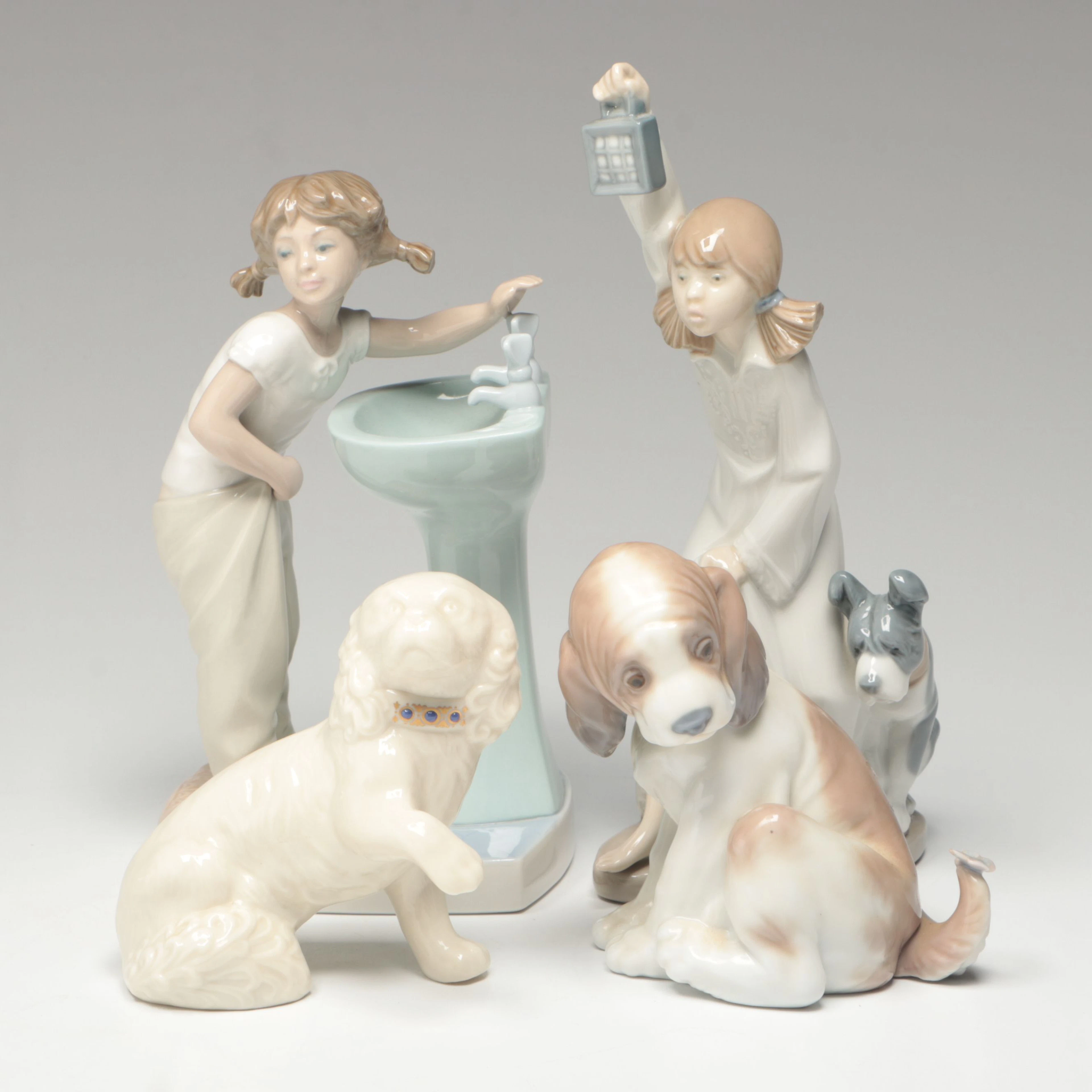 Lladró "Who's There?," "Clean Up Time" and More Porcelain Figurines