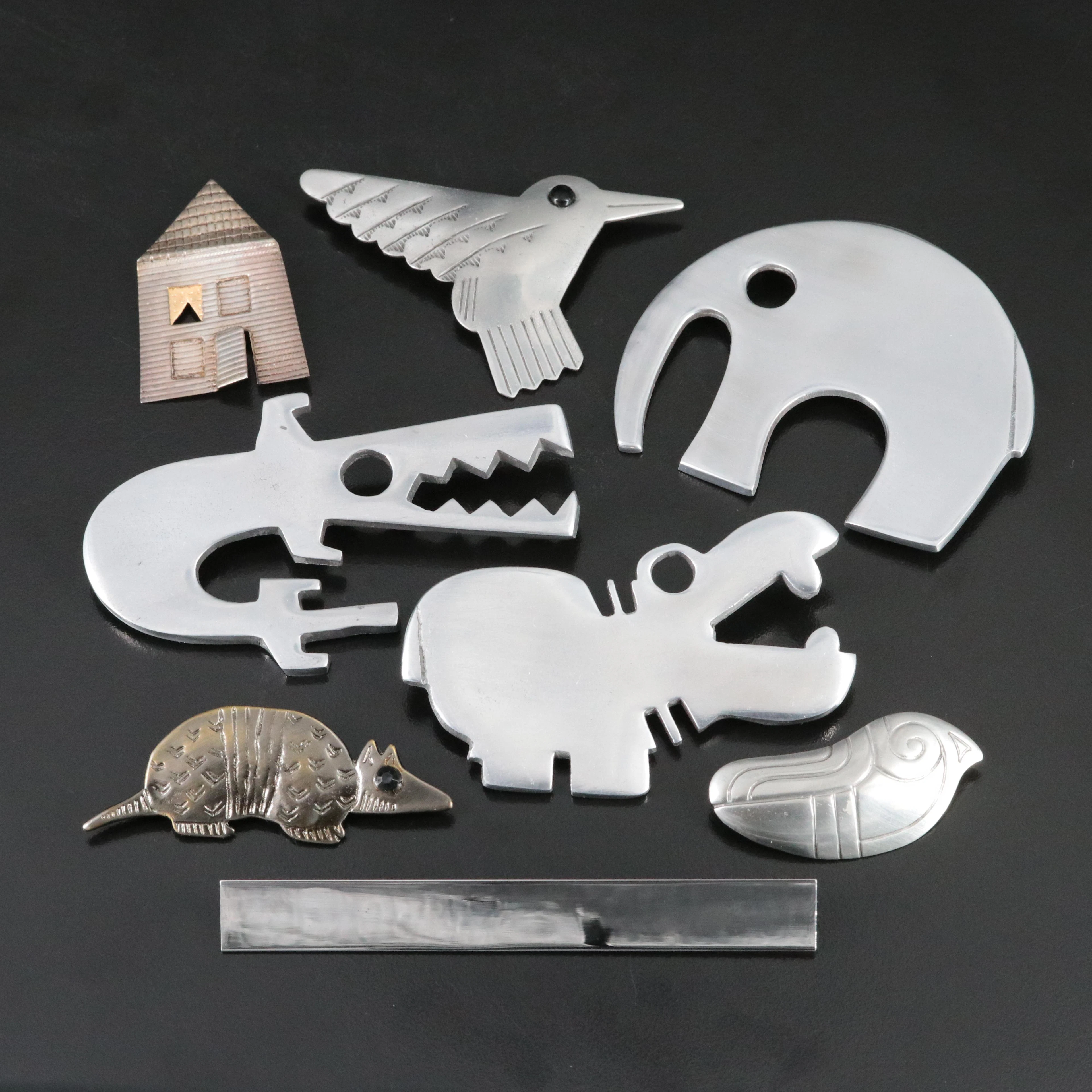 Minimalist Animals and Sterling Featured in Brooch Collection