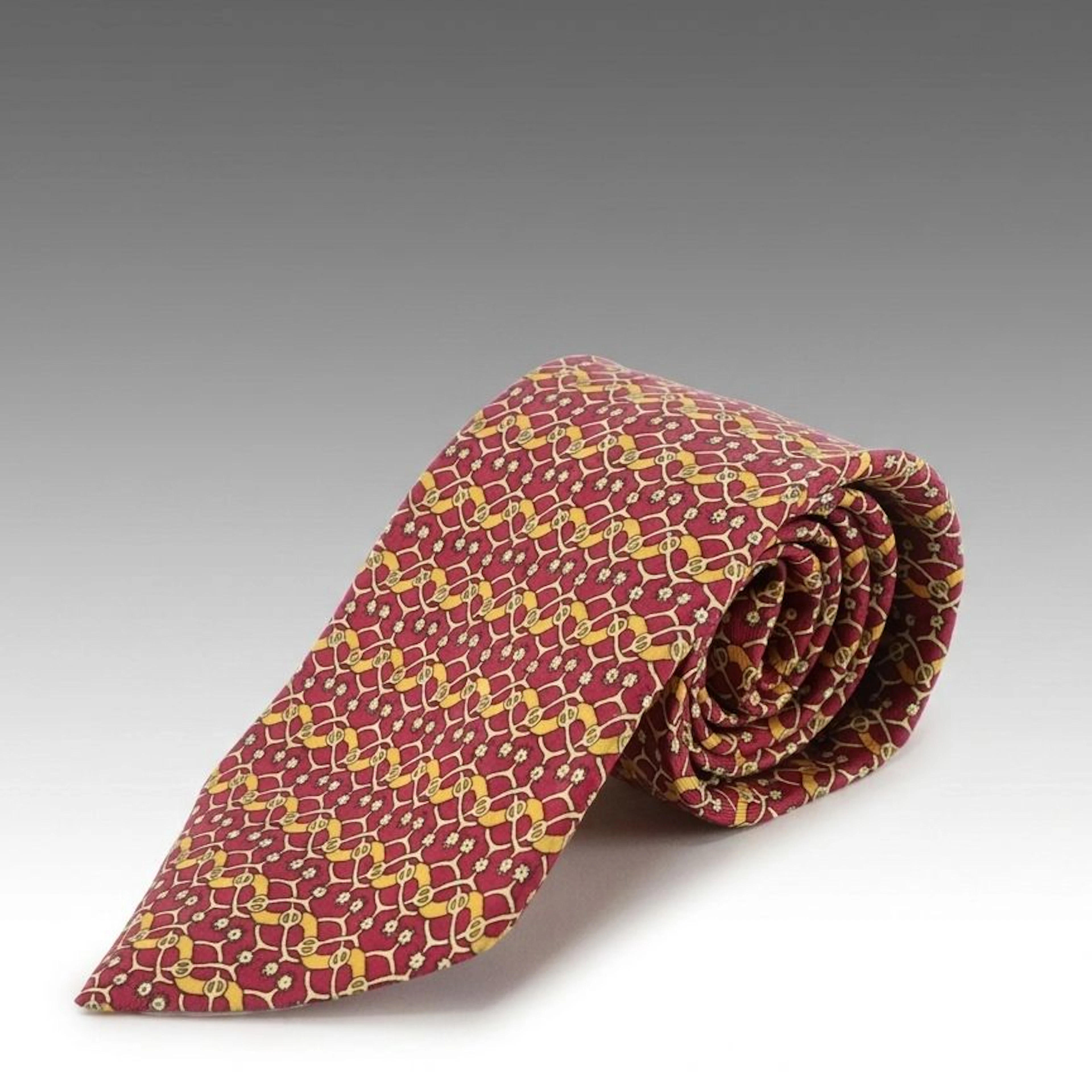 Hermès Silk Neck Tie in Burgundy and Yellow Interlocking Spur Pattern