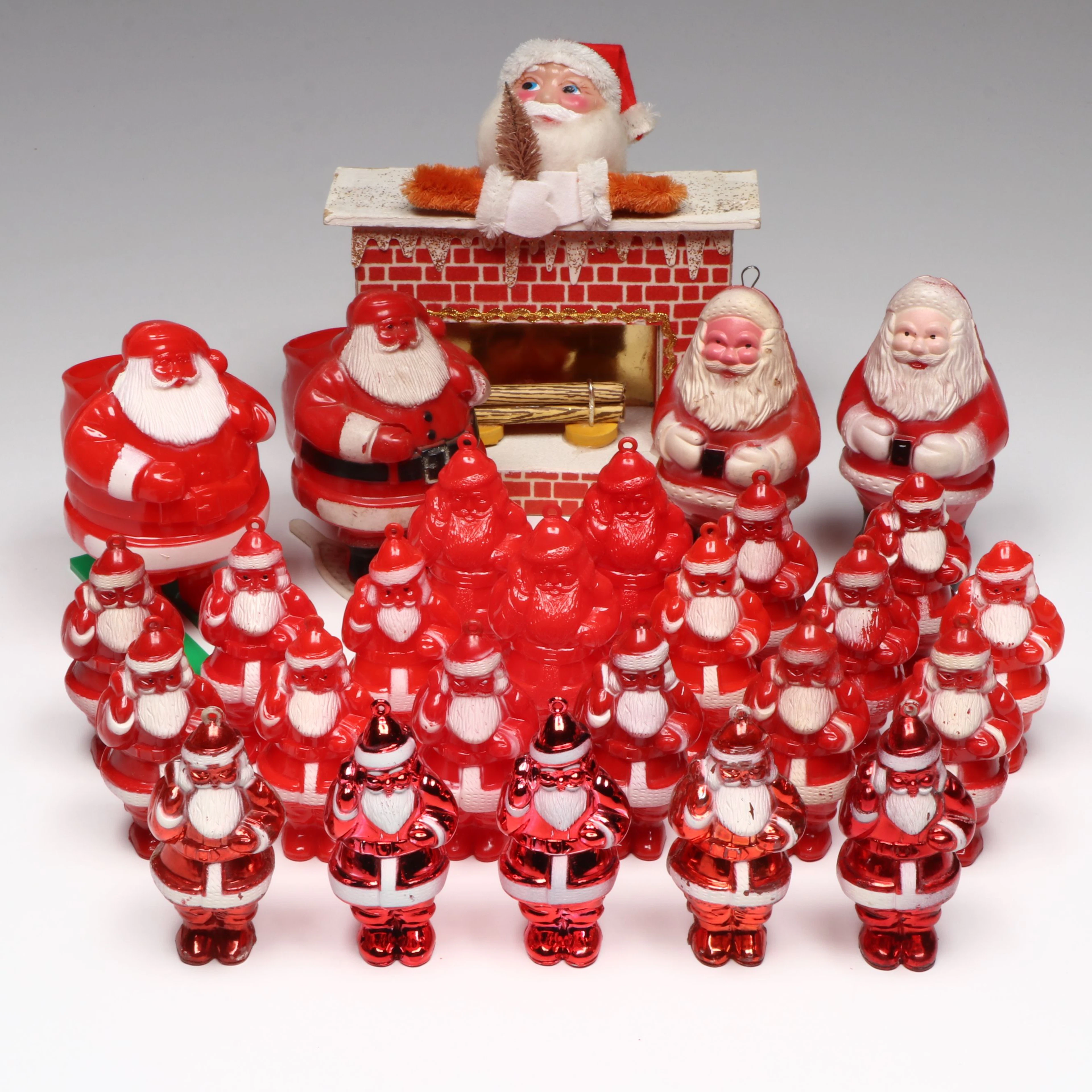 Plastic Santa on Fireplace with Other Mid-Century Santa Figures