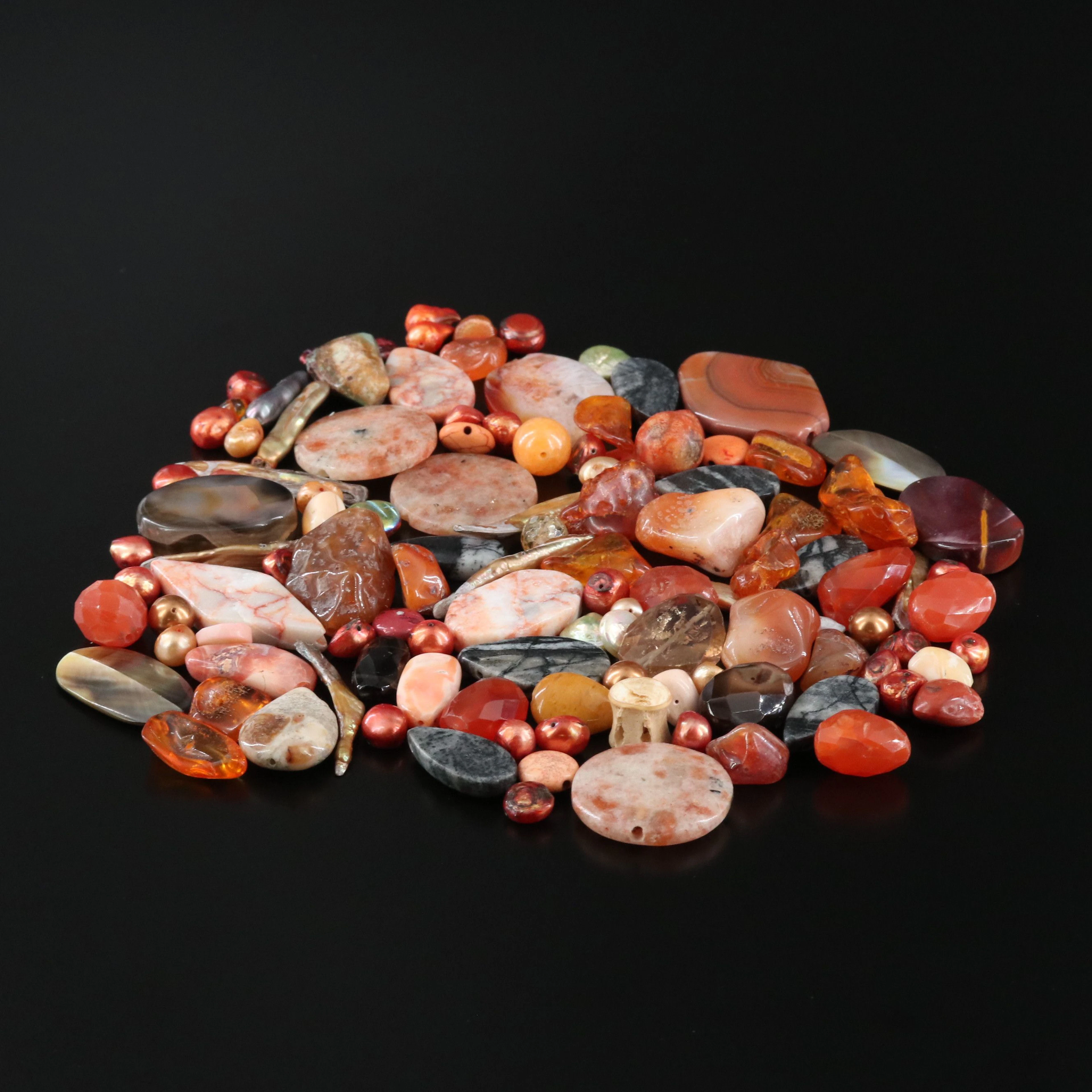 Loose Gemstones Featuring Amber, Orthoceras Fossil and Agate