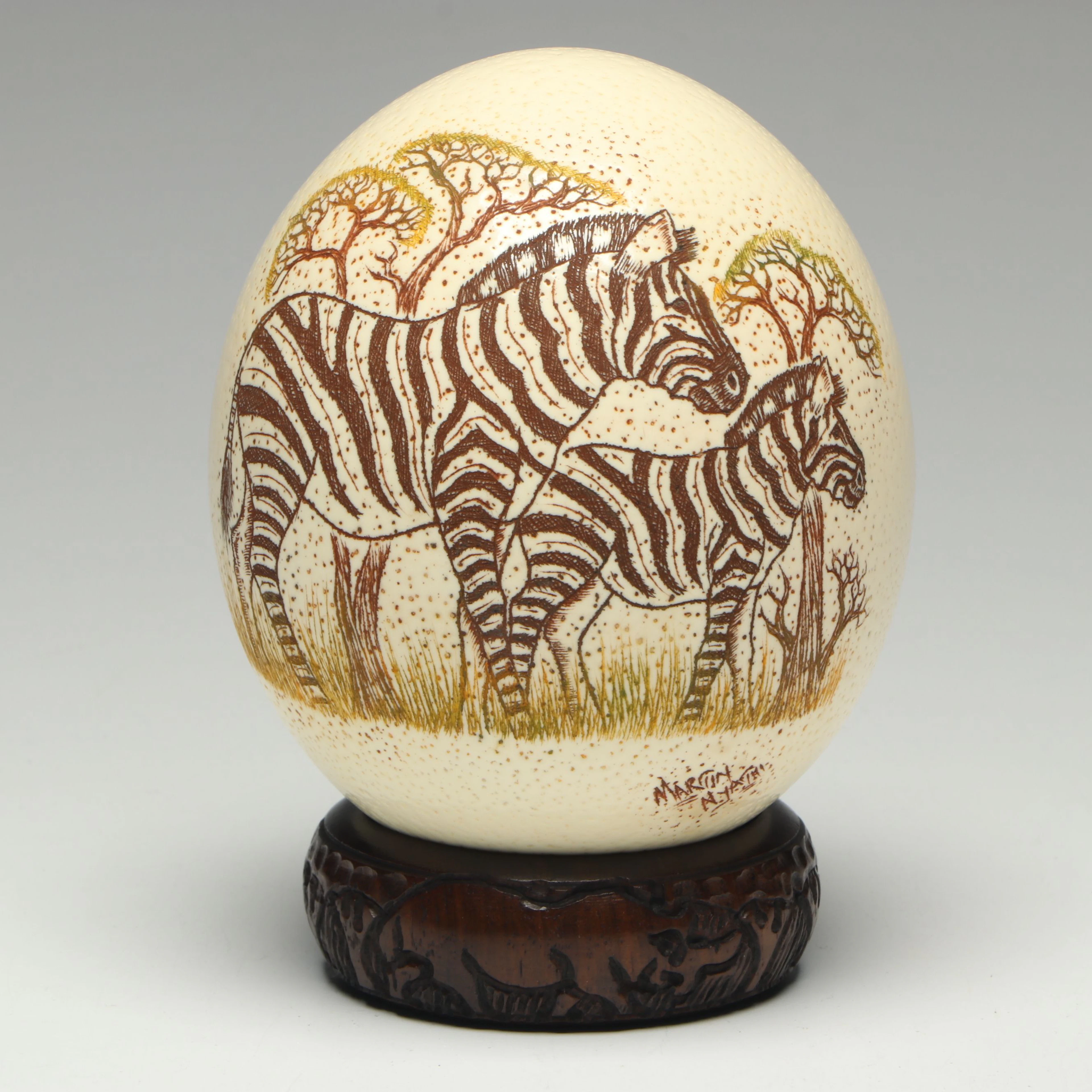 South African Martin Nyathi S Etched Ostrich Egg with Bangle Wood Stand
