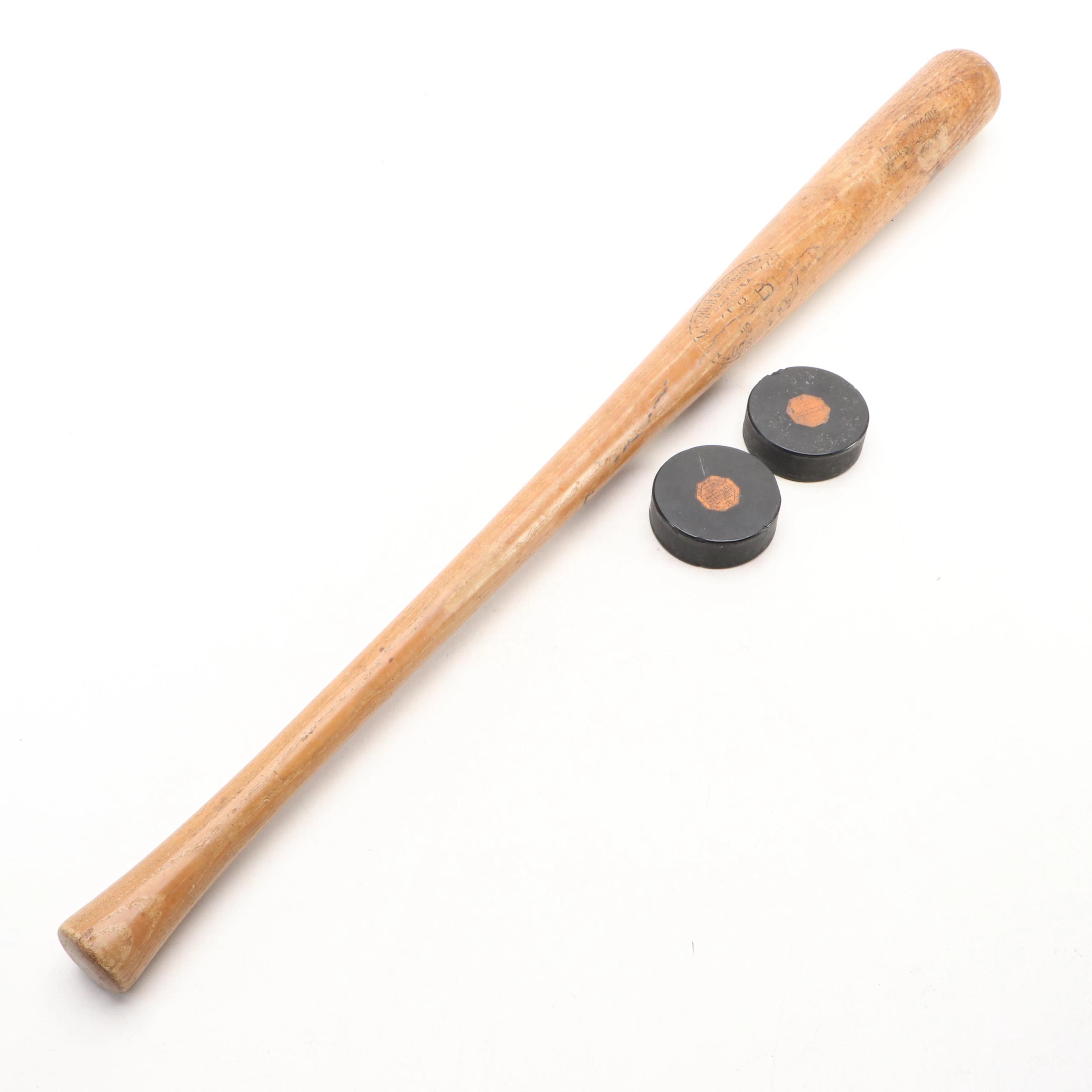 Hillerich & Bradsby Baseball Bat with NHL Hockey Pucks, Mid-20th Century