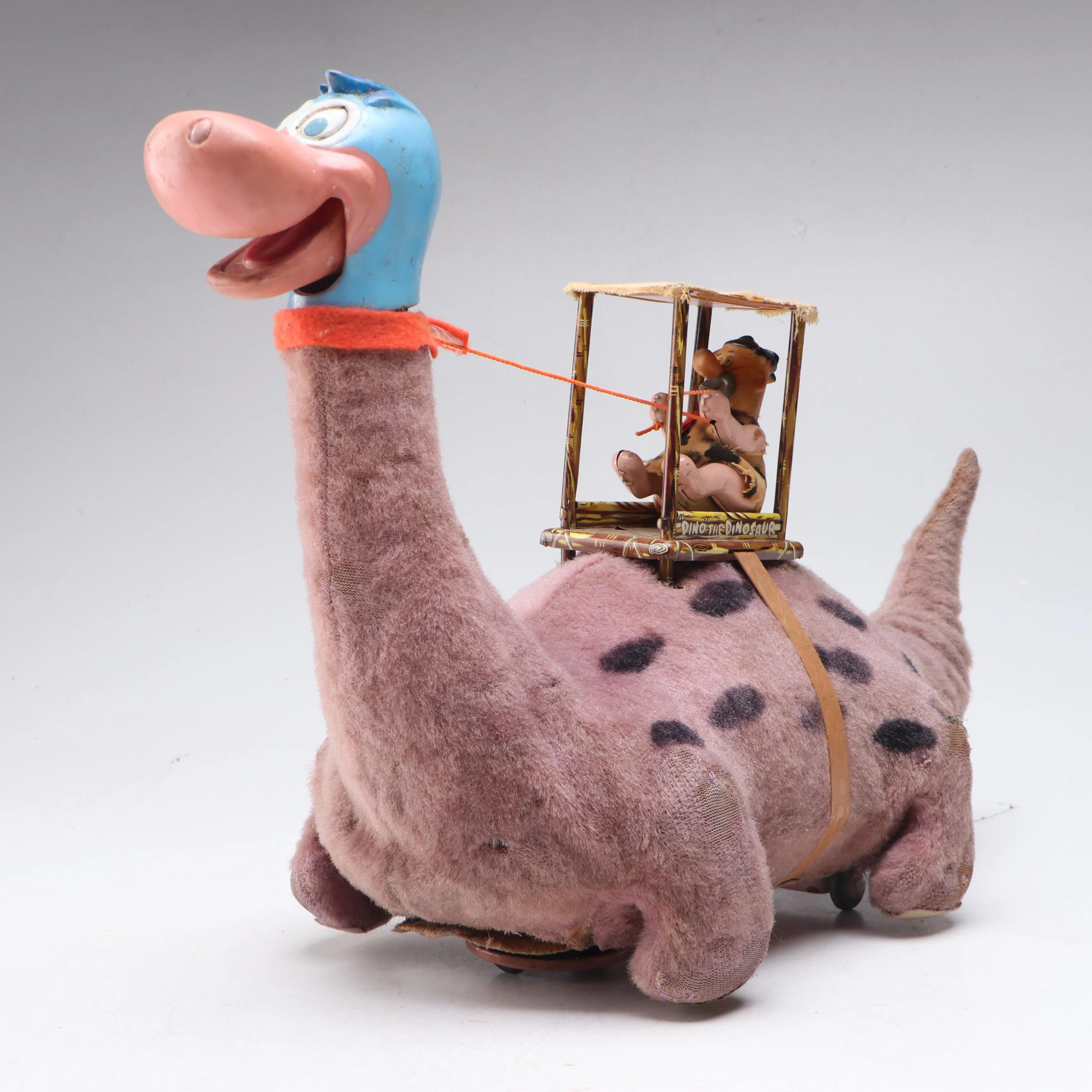 Louis Marx Fred Flintstone Riding Dino Battery-Operated Toy, 1960s