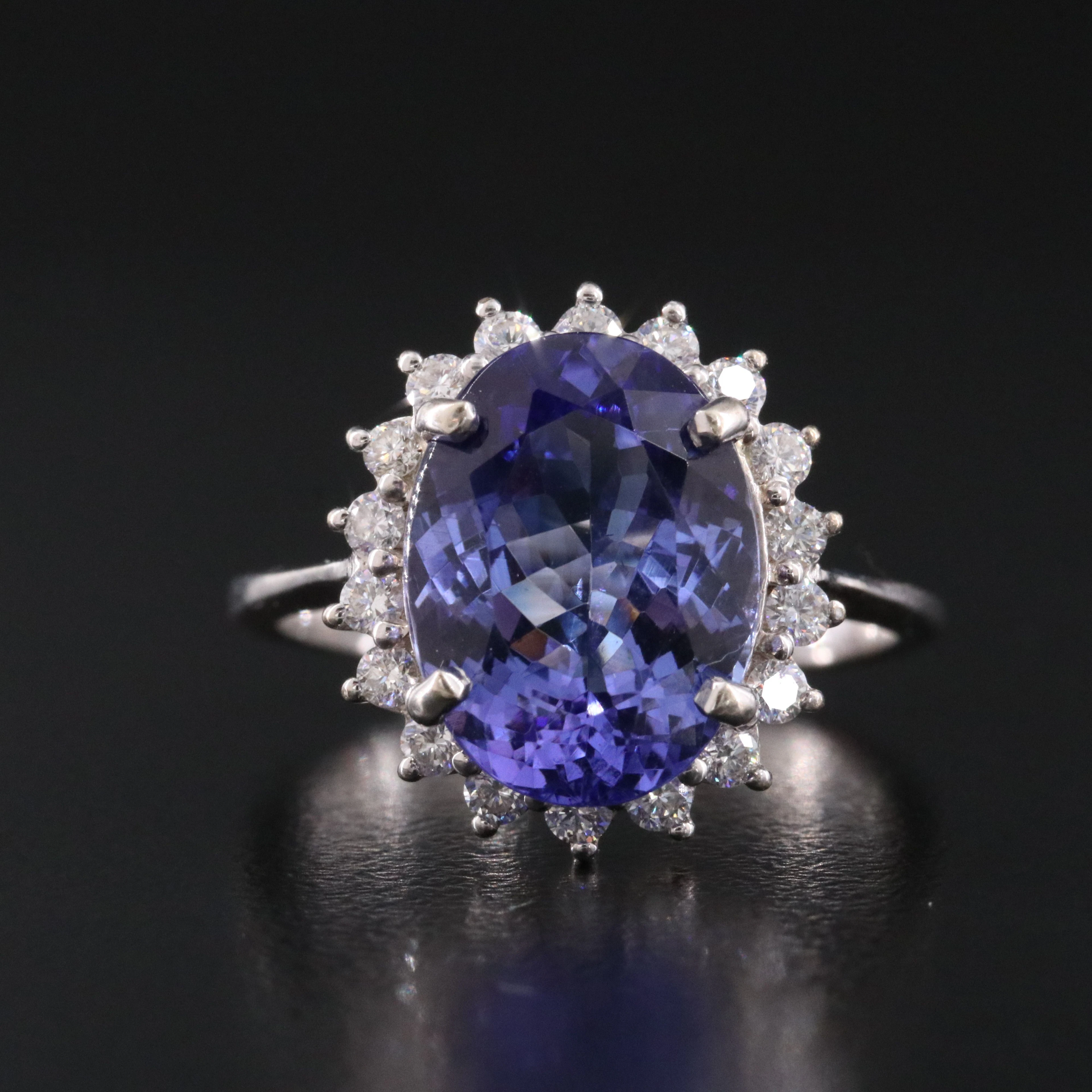 18K 4.65 CT Tanzanite and 0.50 CTW Diamond Halo Ring