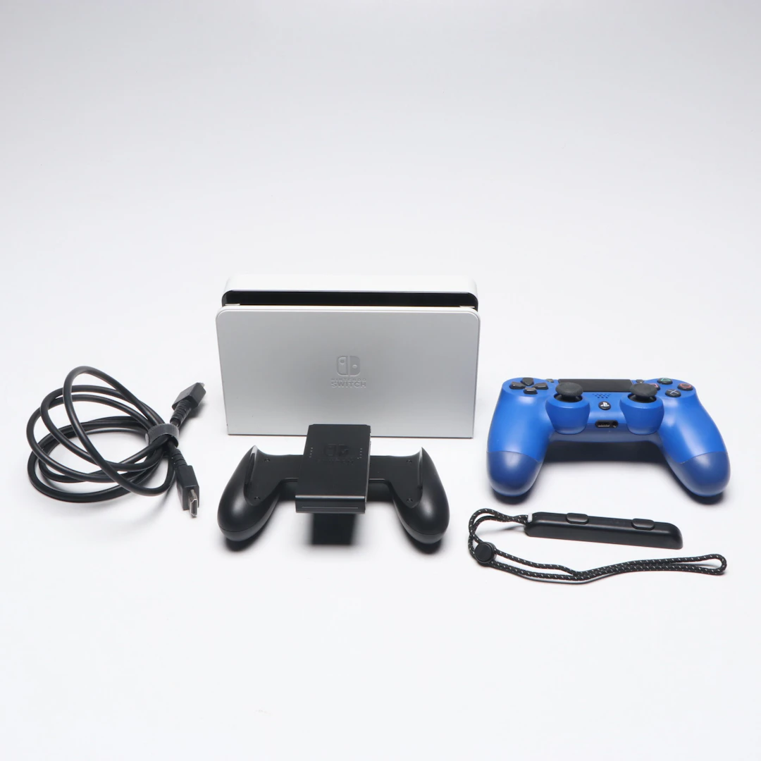 Nintendo Switch Dock, Joy-Con Grip and Sony PlayStation 4 Controller