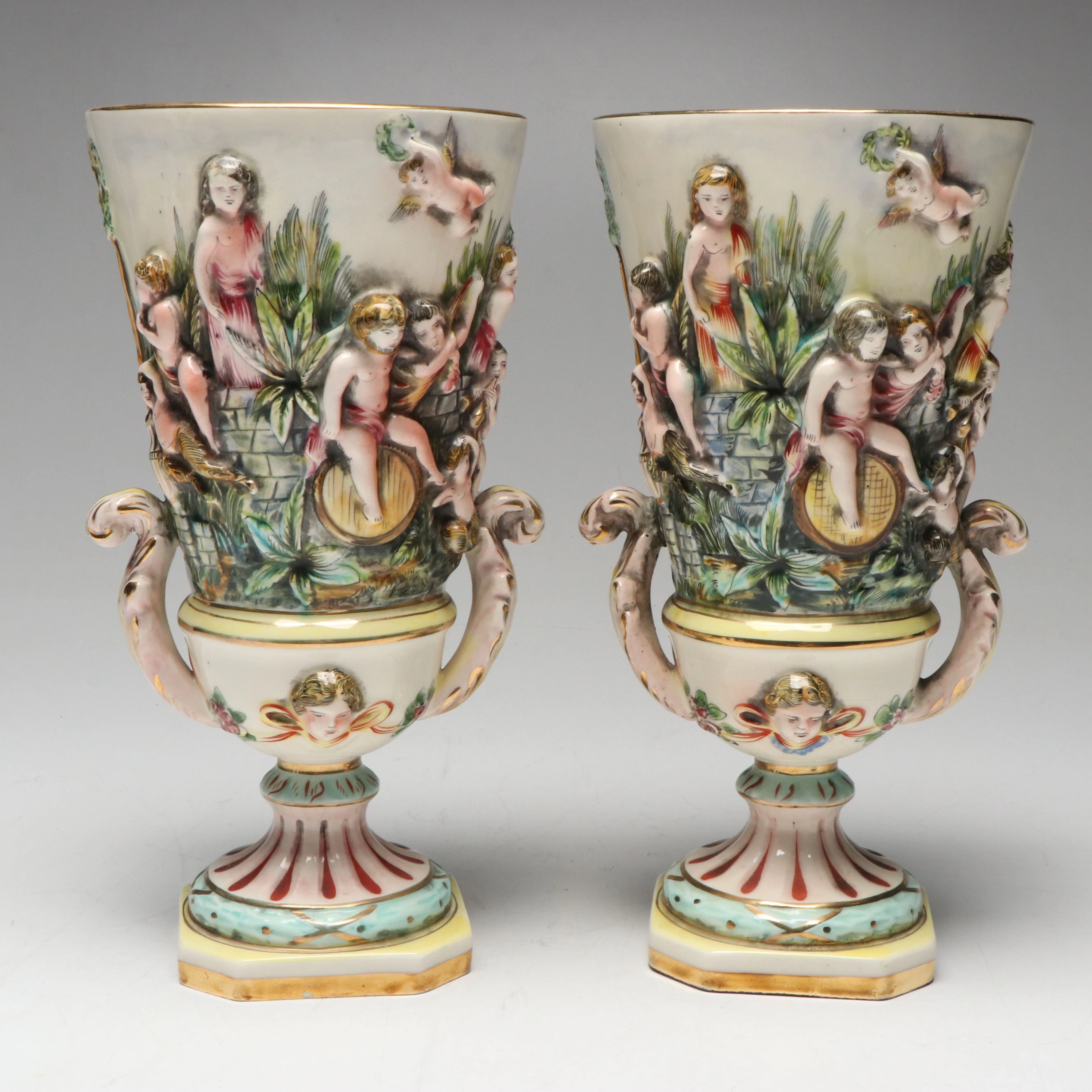 Pair of Capodimonte Hand-Painted Porcelain Urns with Putti