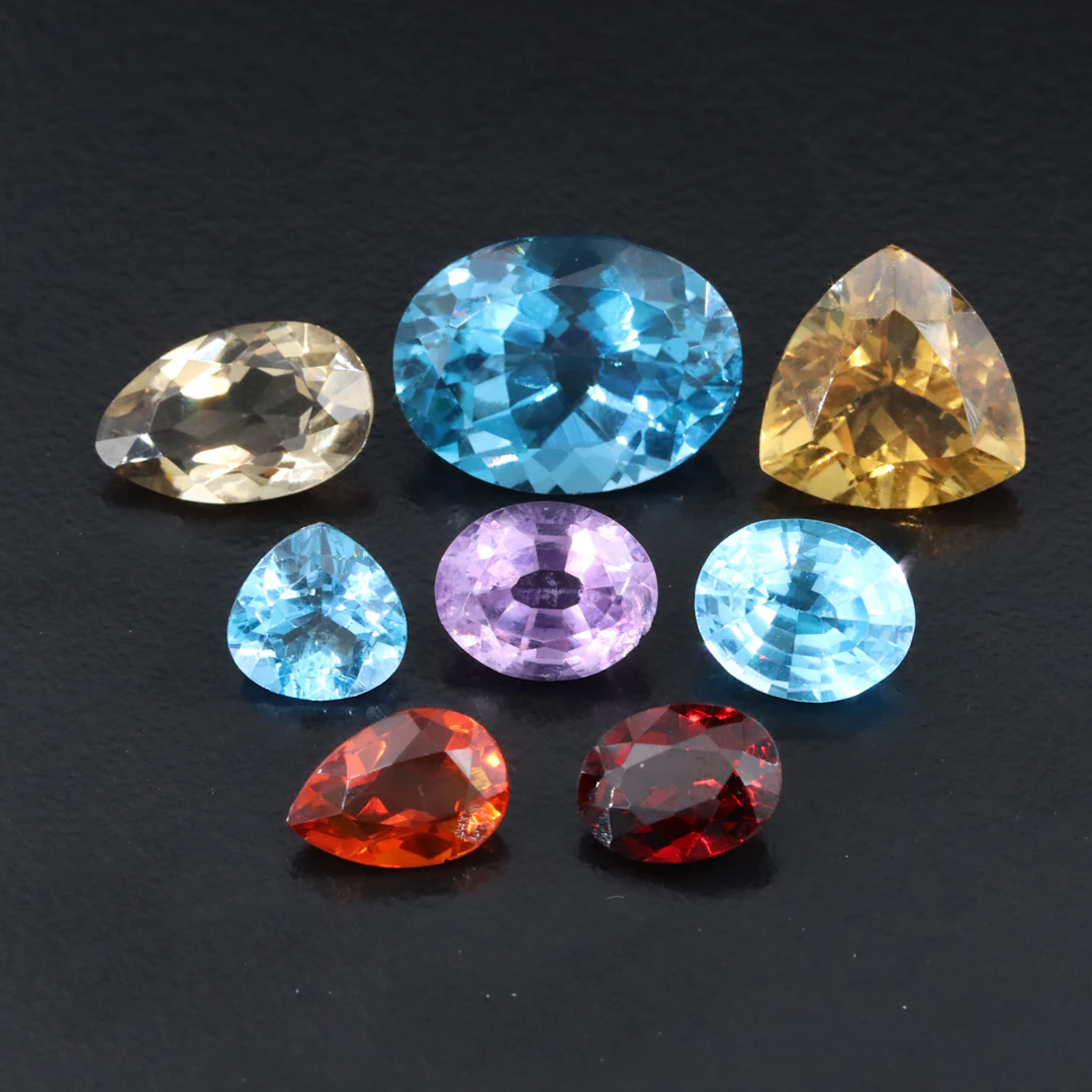 Loose 32.23 CTW Gemstone Lot Including Topaz, Garnet and Smoky Quartz