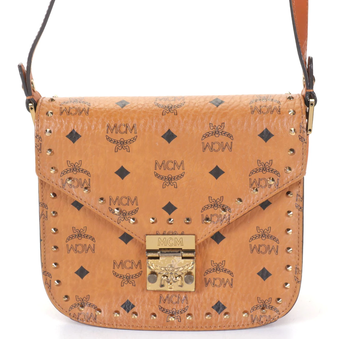 MCM Patricia Gusset Saddle Bag in Studded Cognac Visetos Canvas