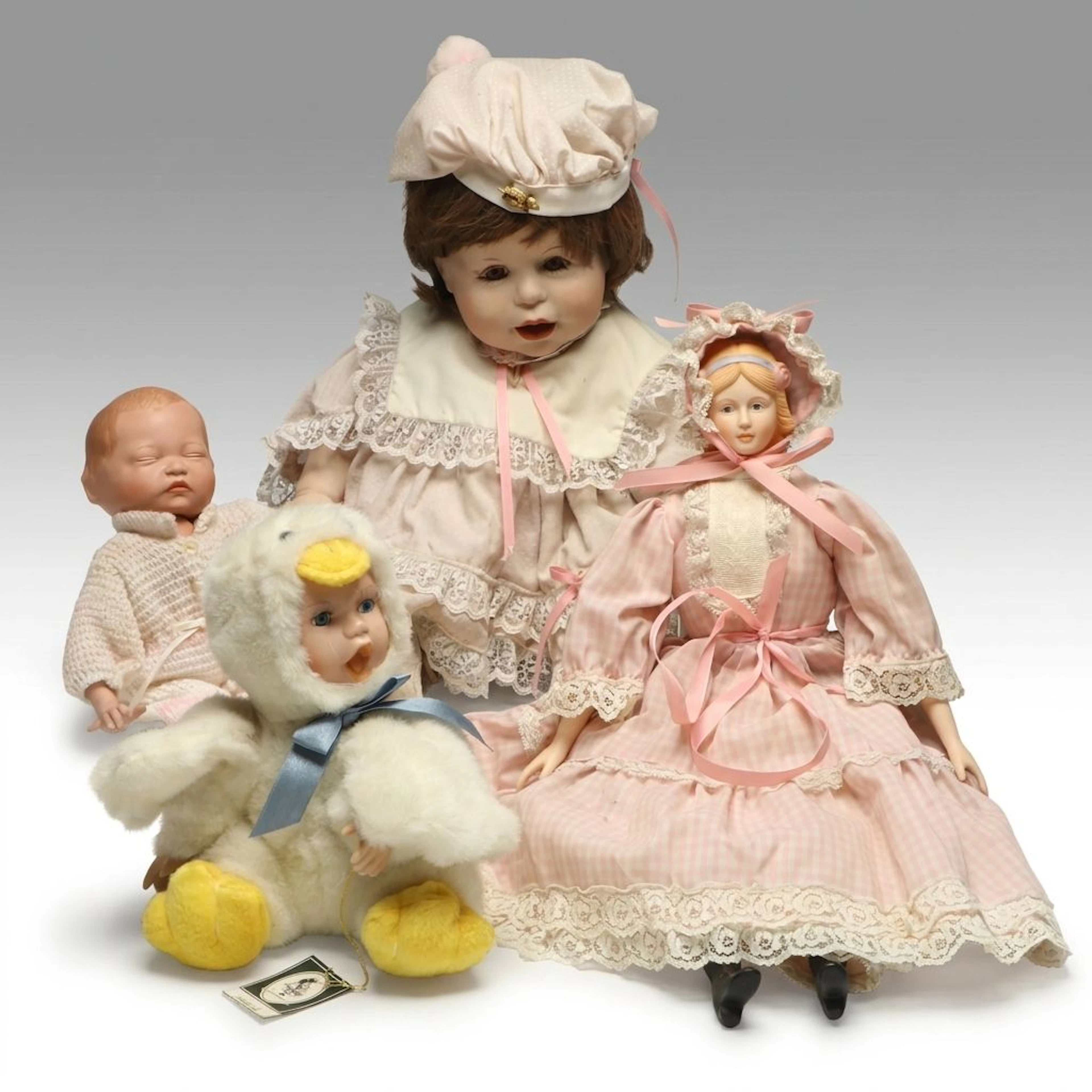 DeHetre "Punkin" with Gepetto "Dominique Duck" and More Porcelain Dolls