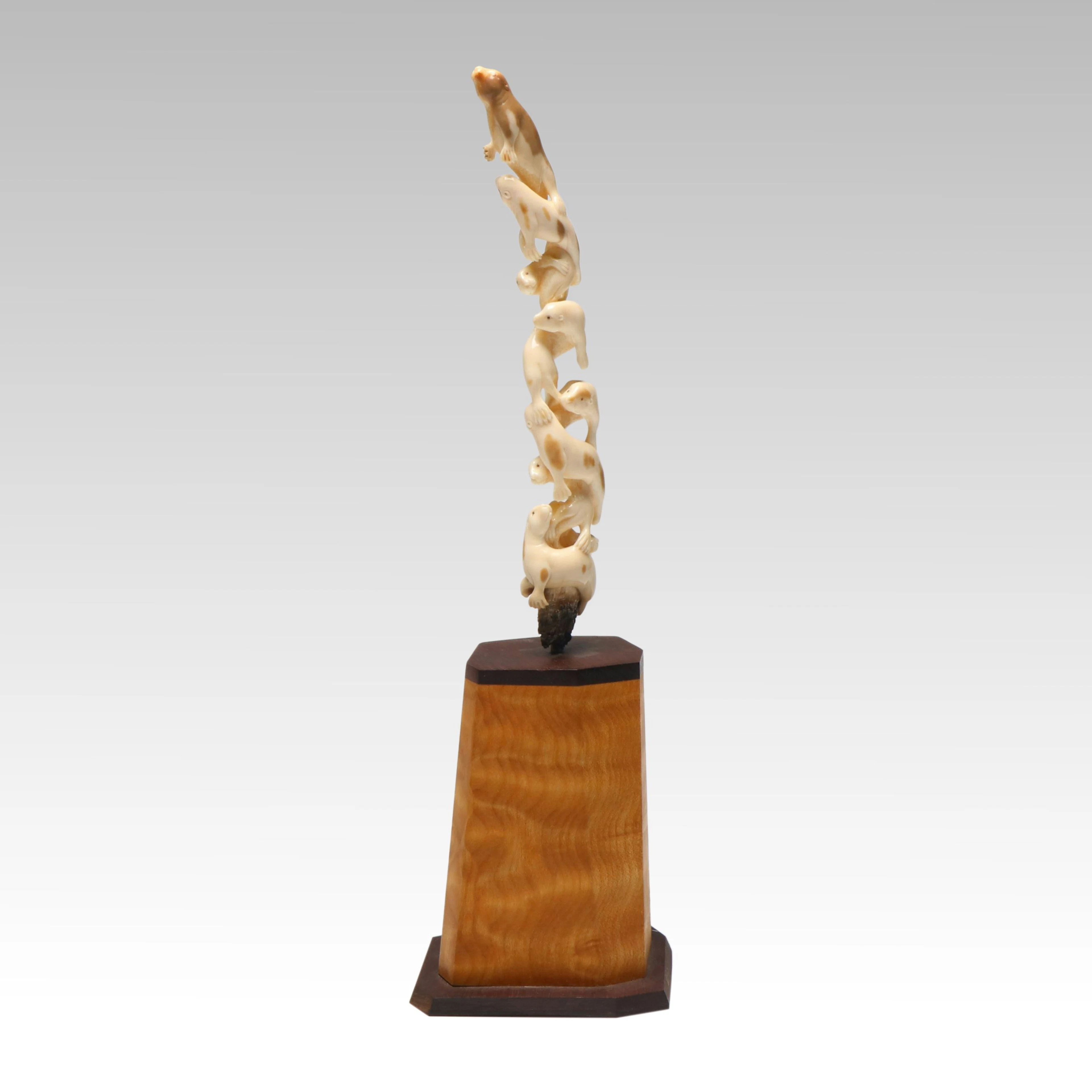 Inuit Carved Fossil Ivory Sea Otter Sculpture on David Present Maple Burl Base