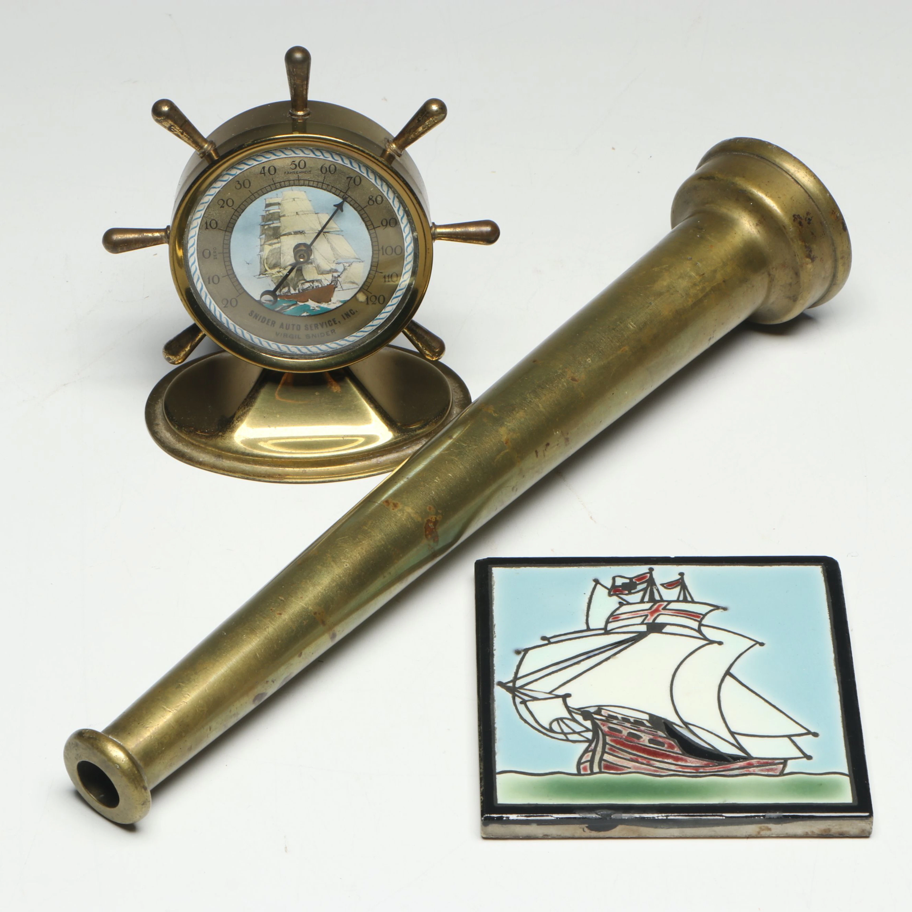 Brass Ship's Wheel Thermometer, Brass Firehose Nozzle, and Ceramic Ship Tile