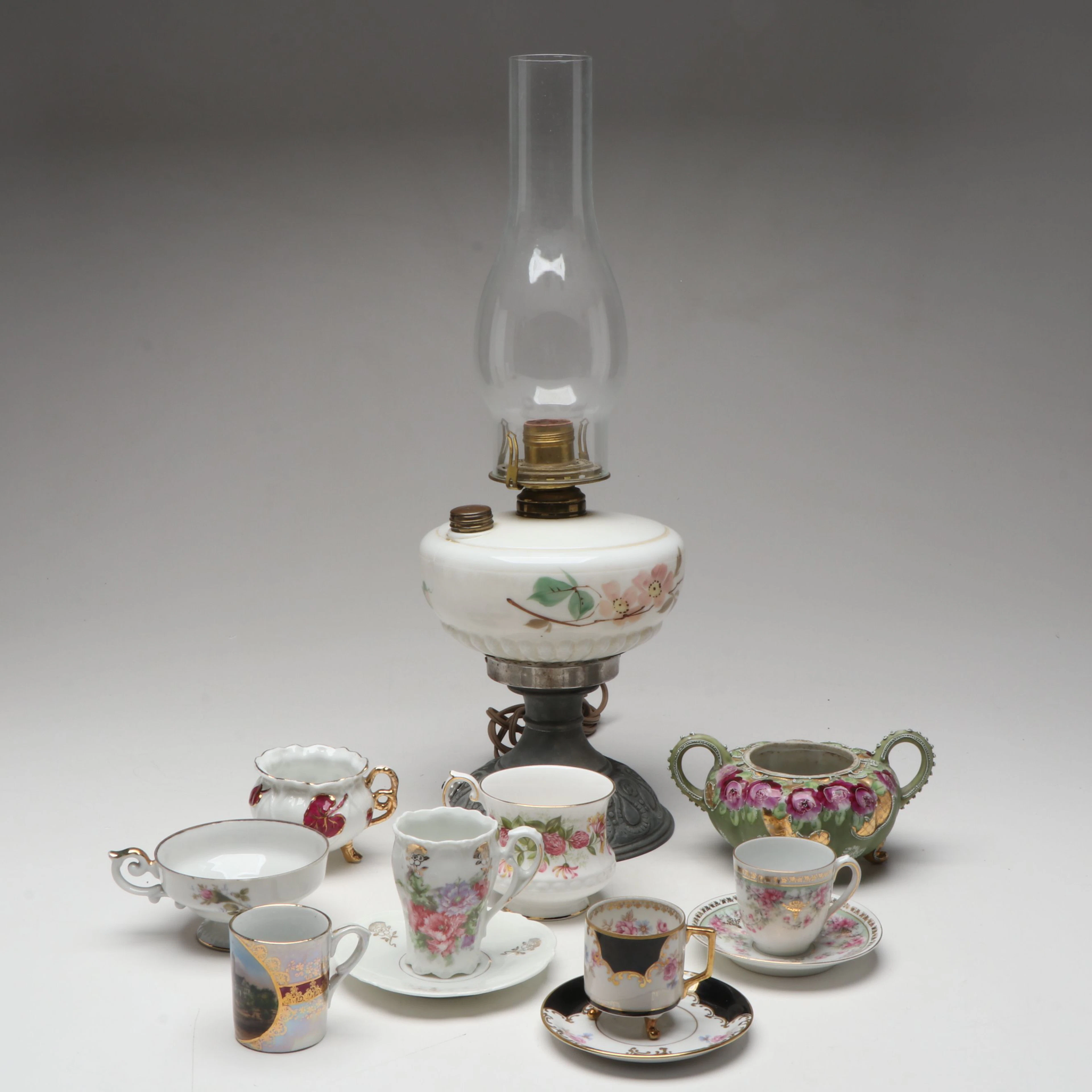 Vintage Cup and Saucer Sets with Glass Lamp and Porcelain Table Accessories