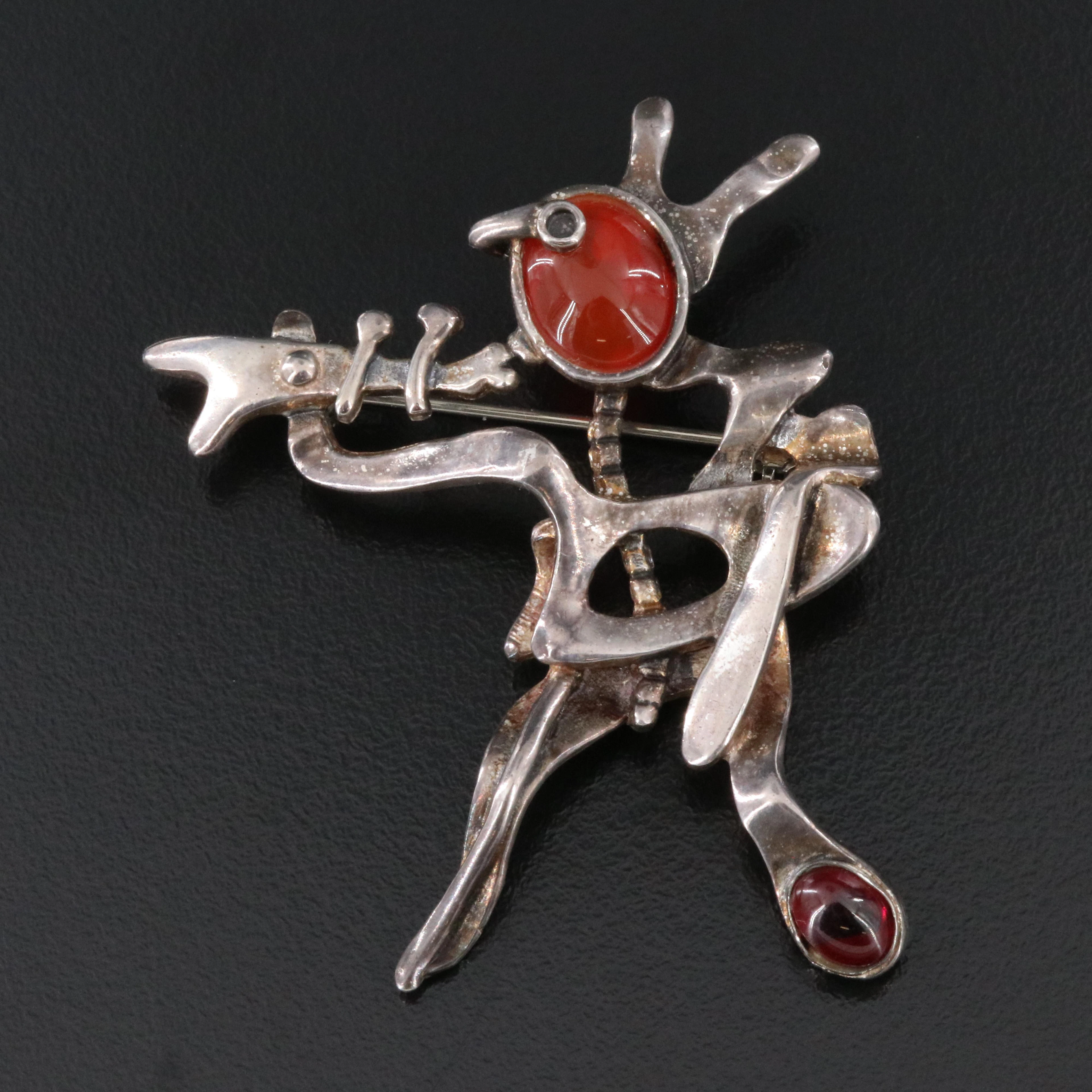 Sam Kramer Modernist, Surrealist Sterling Garnet and Carnelian Trumpeter Brooch