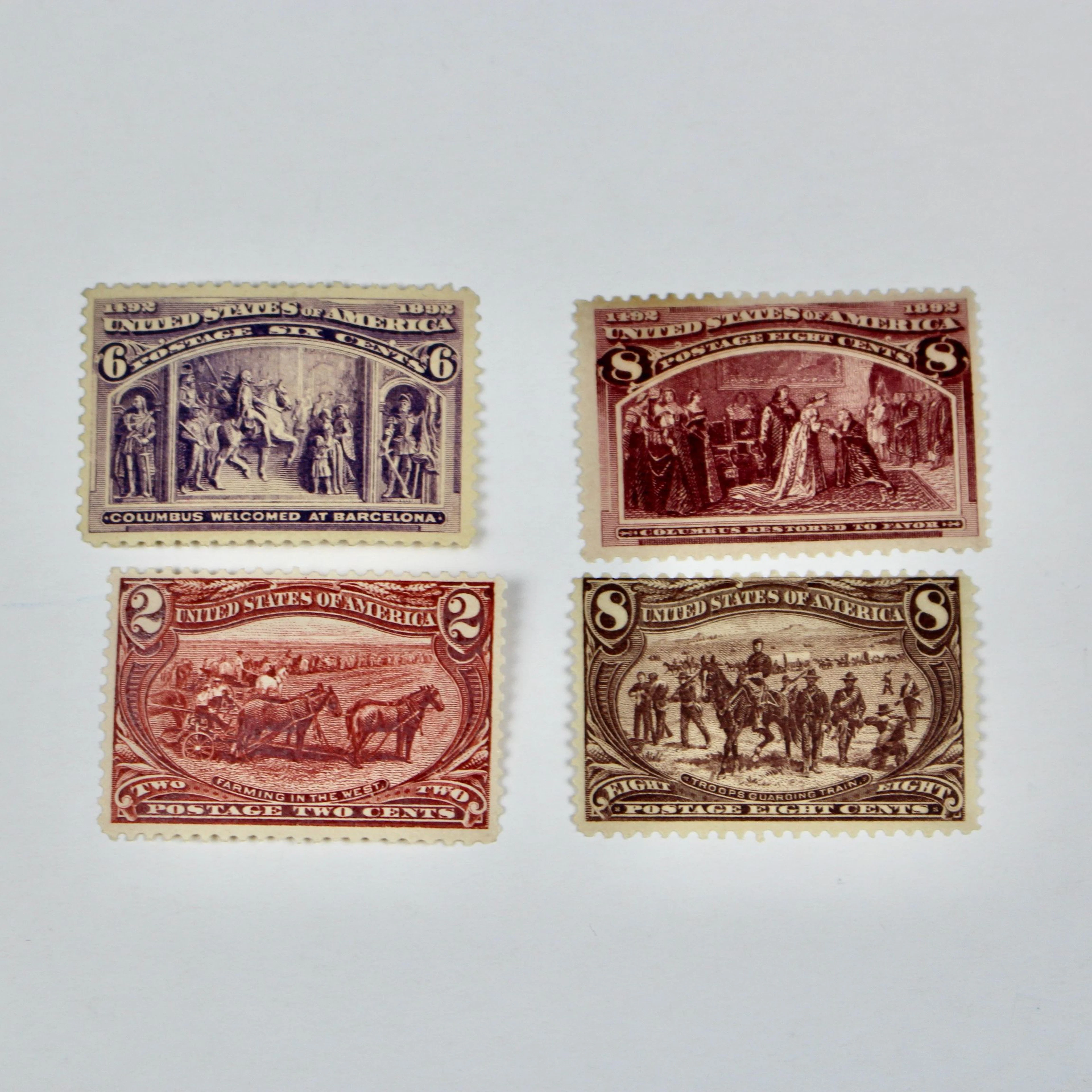 Four Mint Condition Columbian and Trans-Mississippi Postage Stamps, 1890s