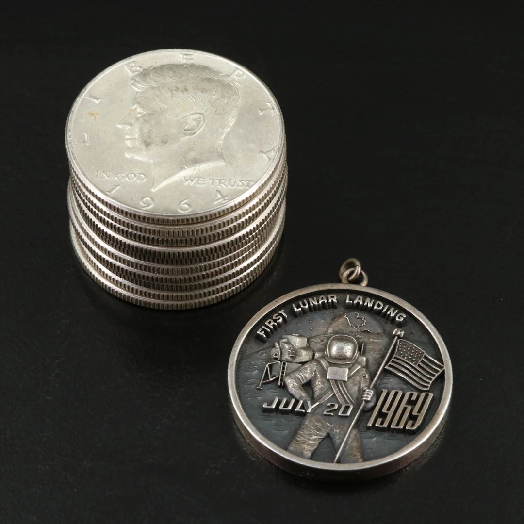 Ten 1964 Kennedy Half Dollars and a 1969 Silver Lunar Landing Medal