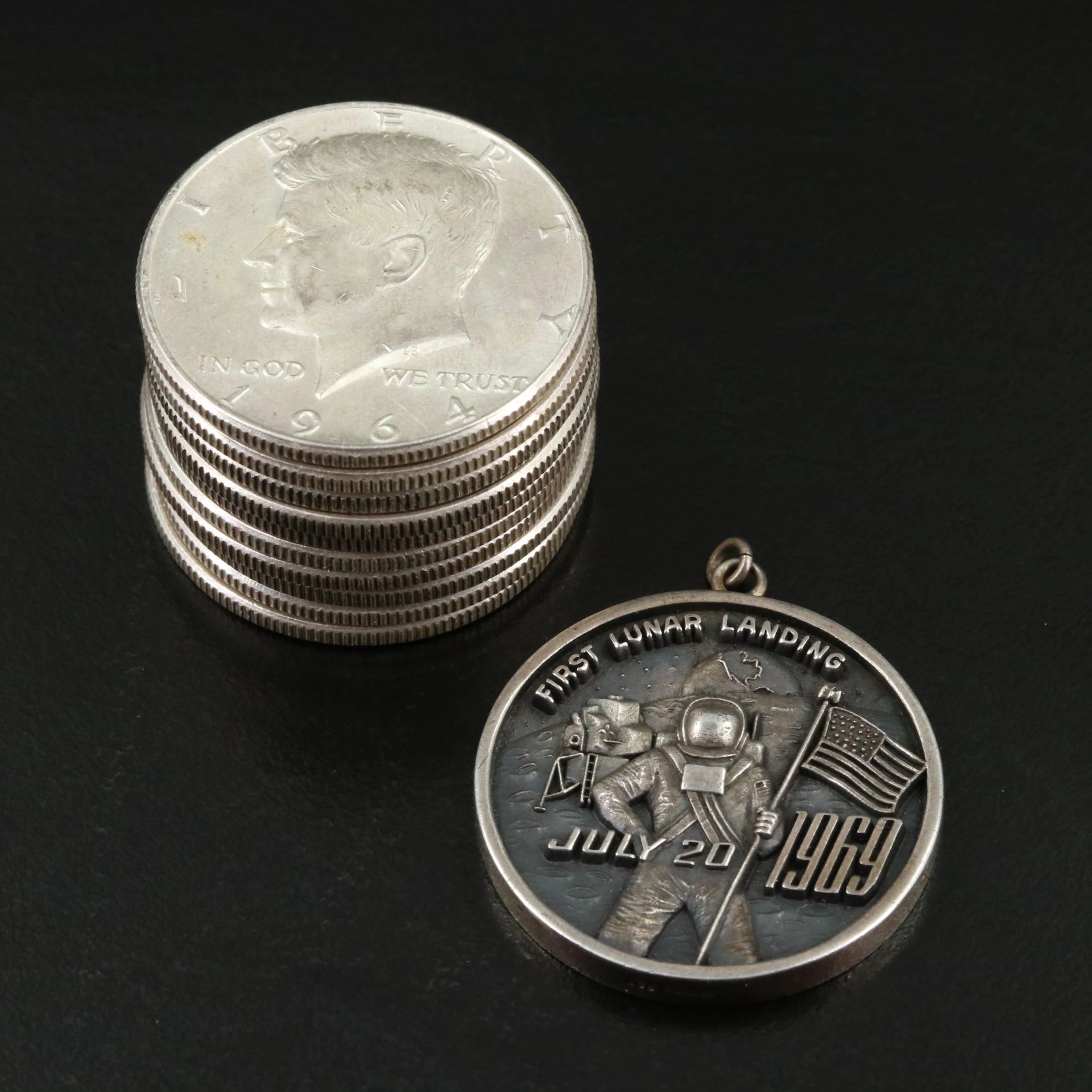 Ten 1964 Kennedy Half Dollars and a 1969 Silver Lunar Landing Medal