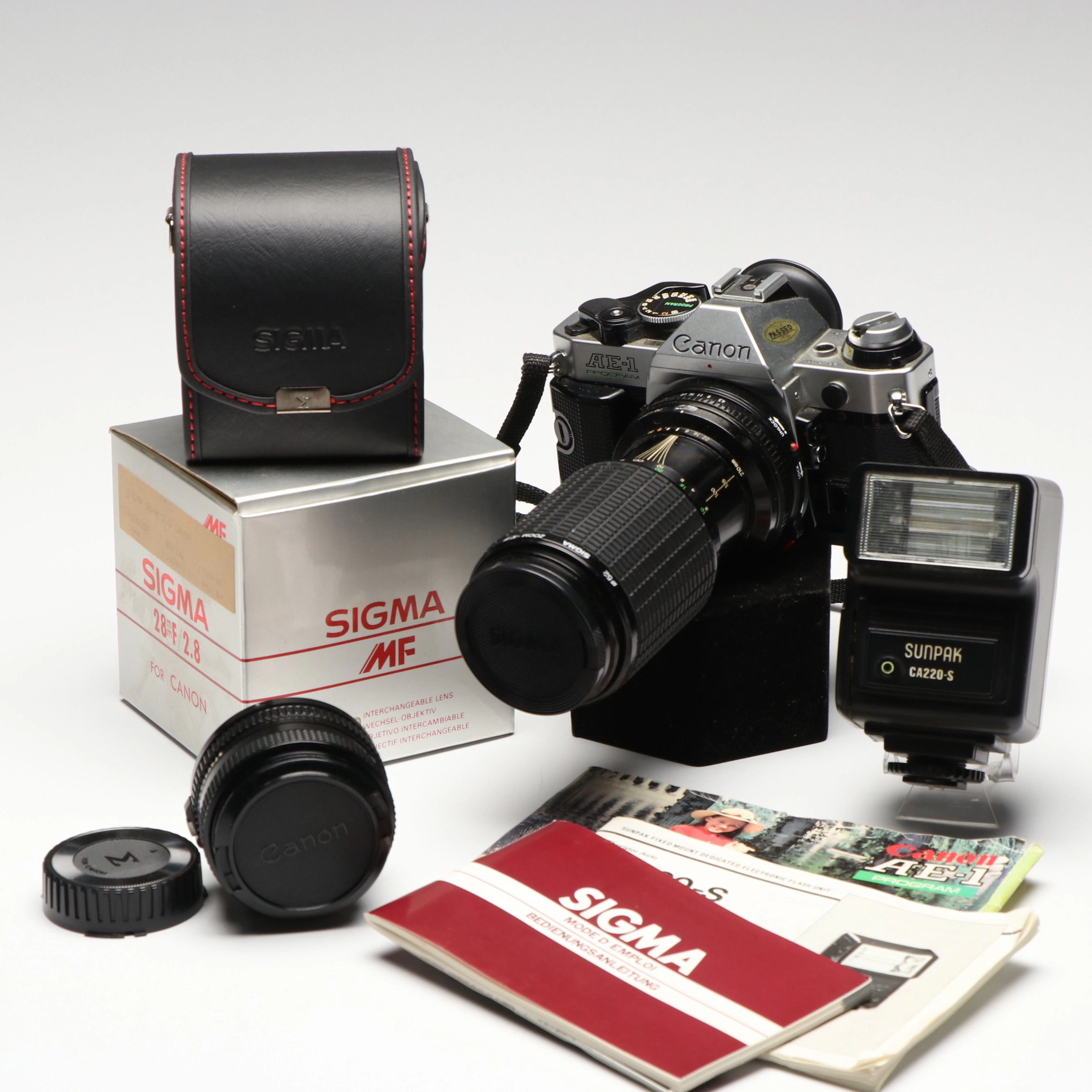Canon AE-1 35mm Film Camera, Sigma Zoom Lens, Hot Shoe Flash, Other Accessories