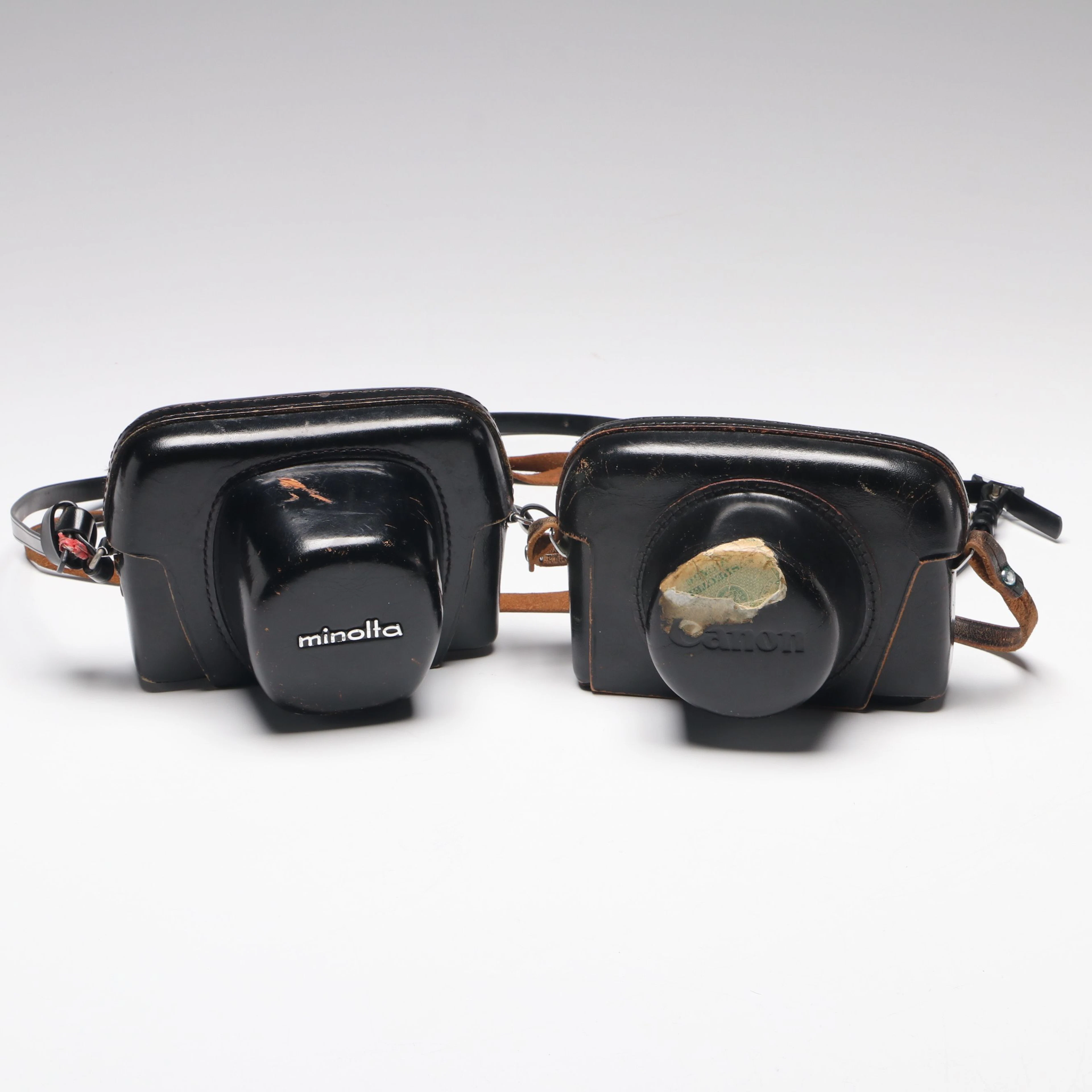 Minolta Hi-Matic 11 and Canon Film Cameras in Leather Cases, Mid-20th Century