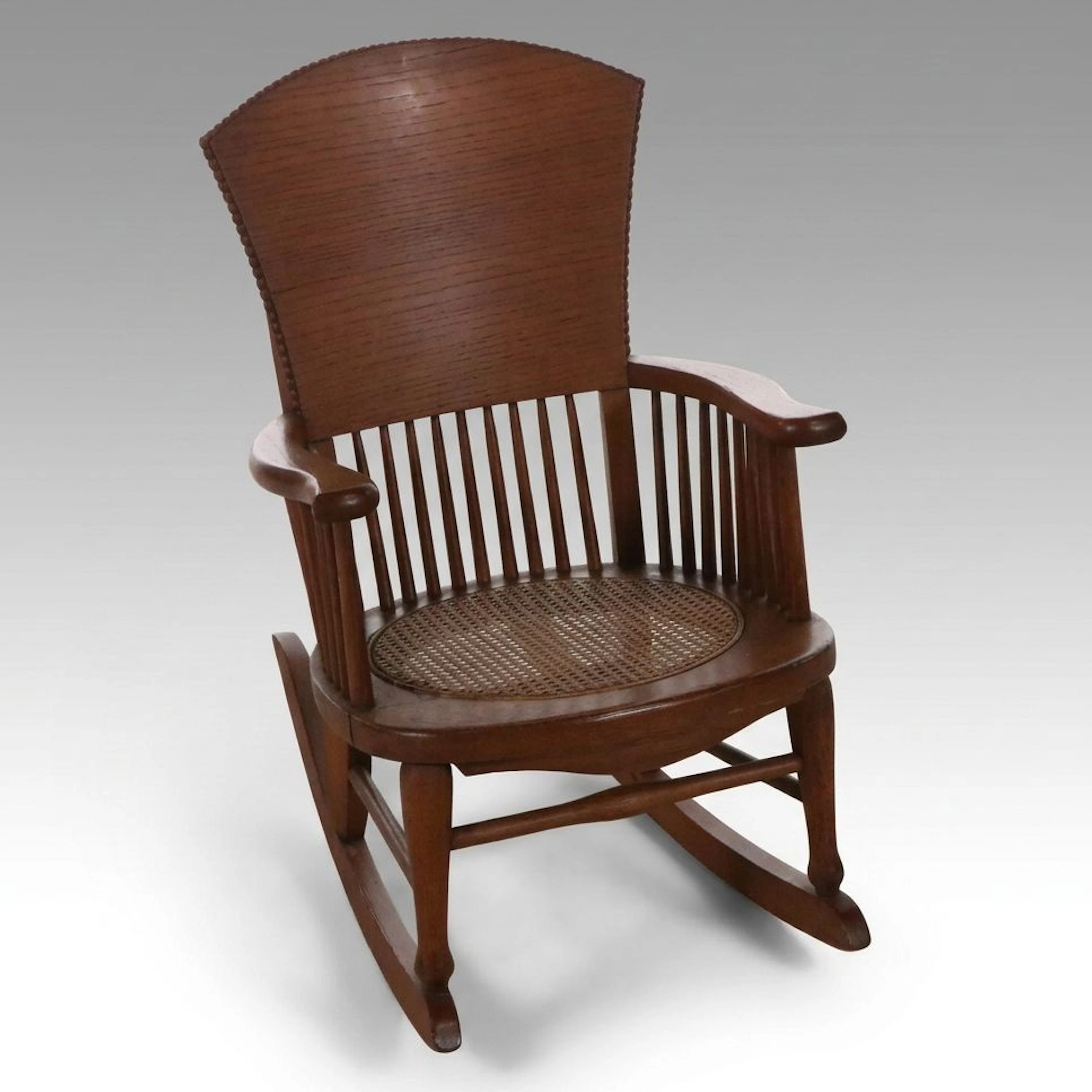 Child's Oak Spindle Back Rocking Chair with Cane Seat, Early 20th Century